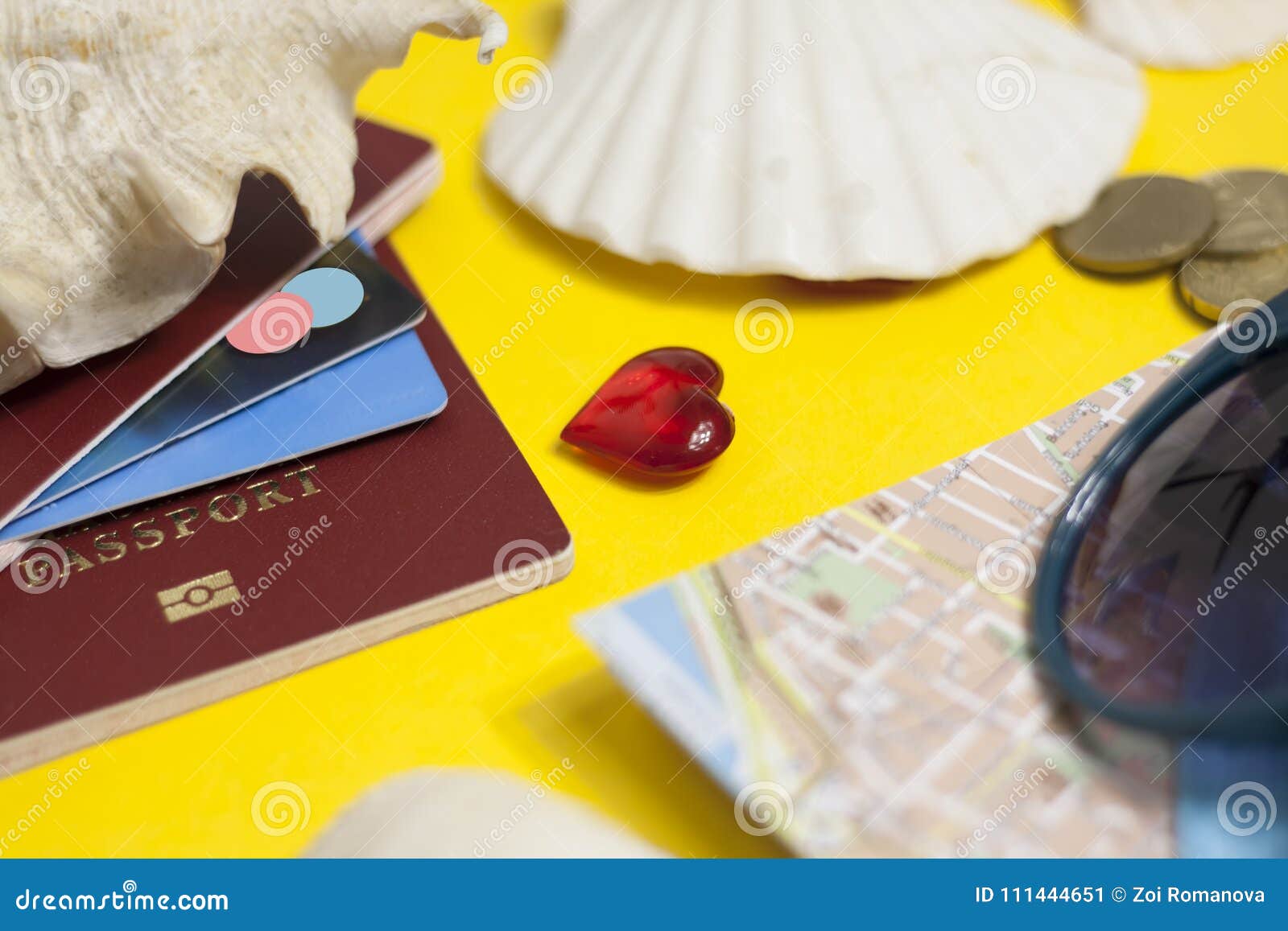 passport, credit card, travel accessories, seashells. vacation documents. turism concept. selective focus.