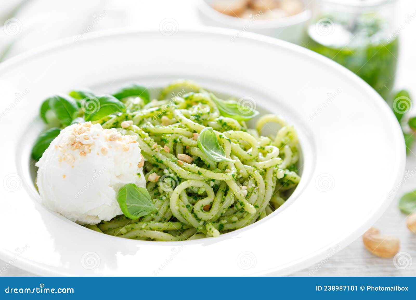 Pasta with Basil Pesto, Cashew Nuts and Soft Cream Cheese Stock Image