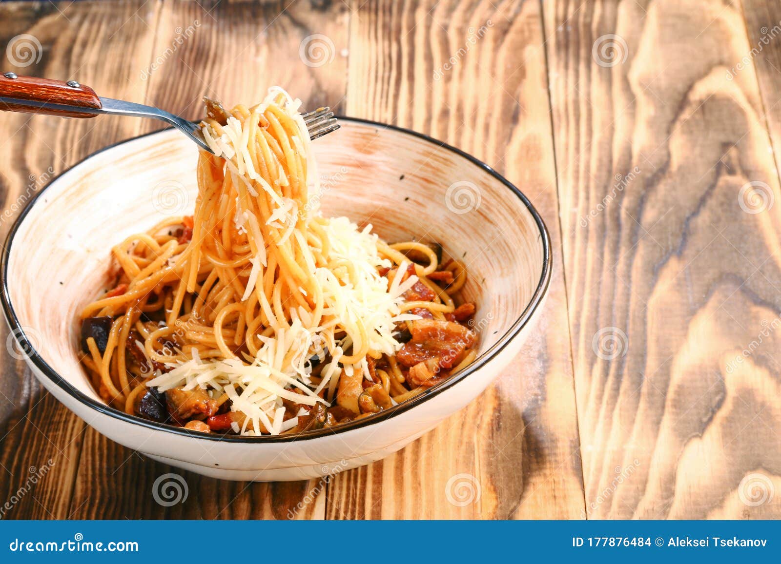 Pasta with Beer Sauce and Parmesan Closeup. Pasta on Fork Stock Photo