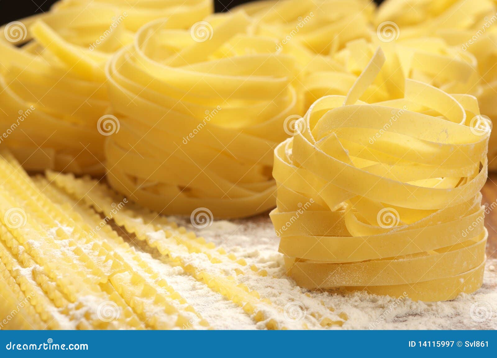 Pasta in flour stock image. Image of noodles 14115997