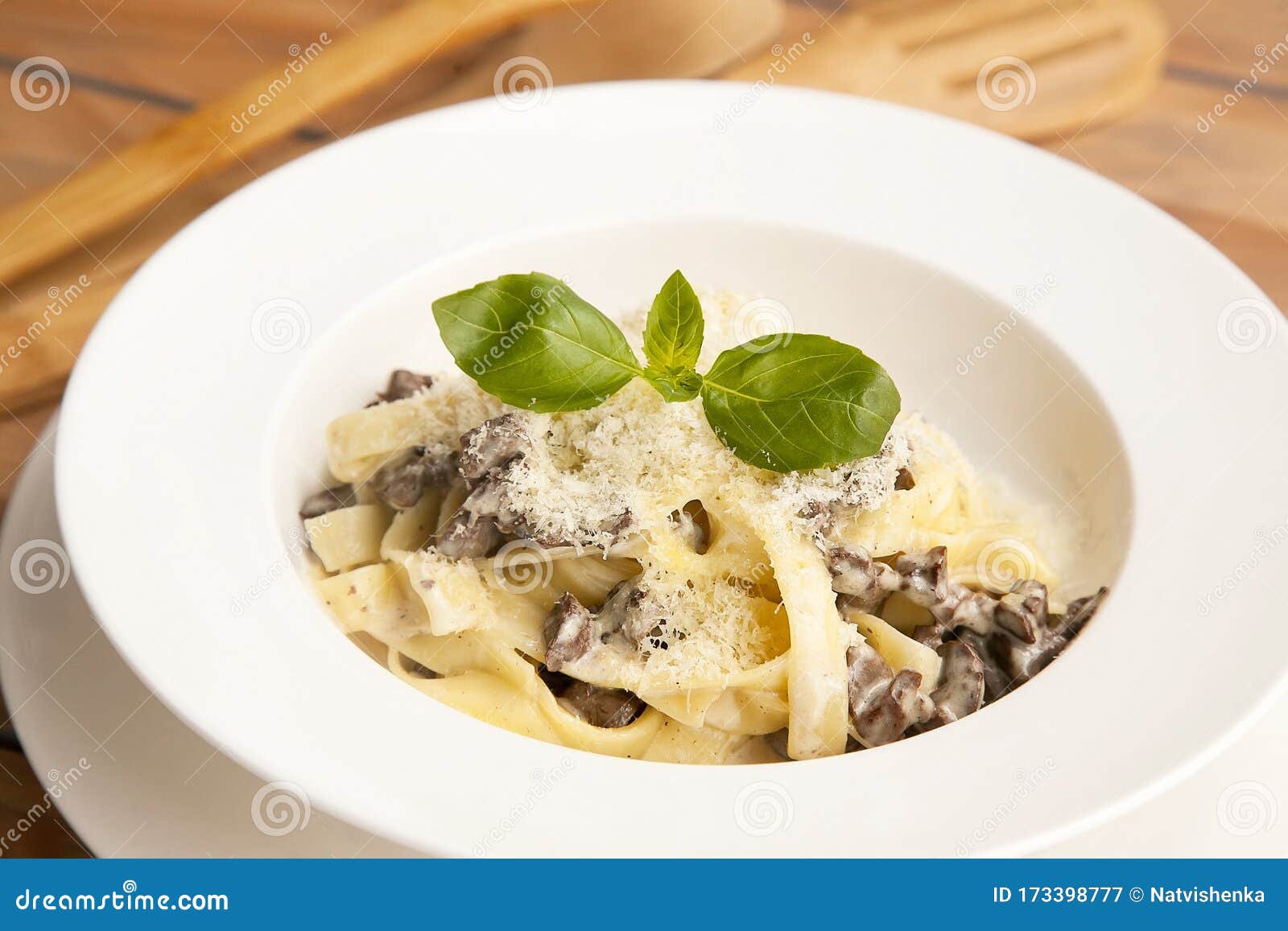 Pasta with Mushrooms in White Sauce on the Plate. European Cuisine