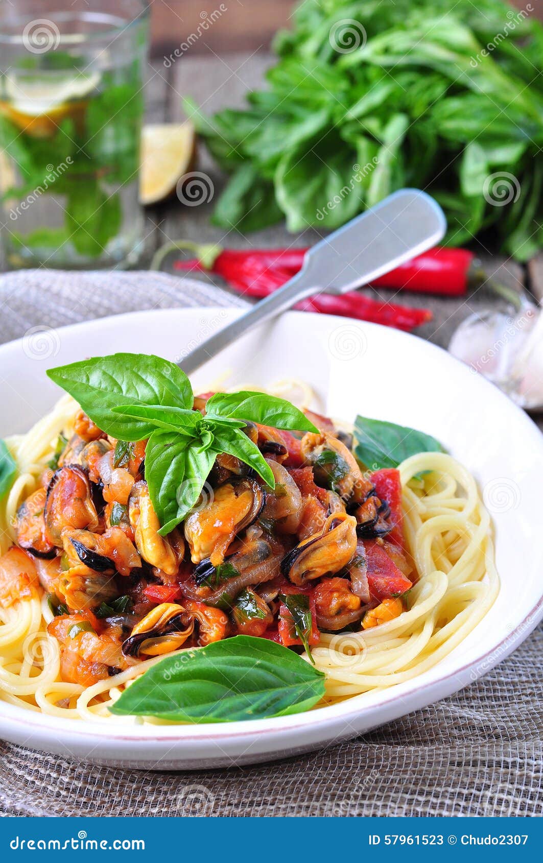 Pasta with Mussels, Pepperoni, Bacon, Tomato and Basil Stock Image