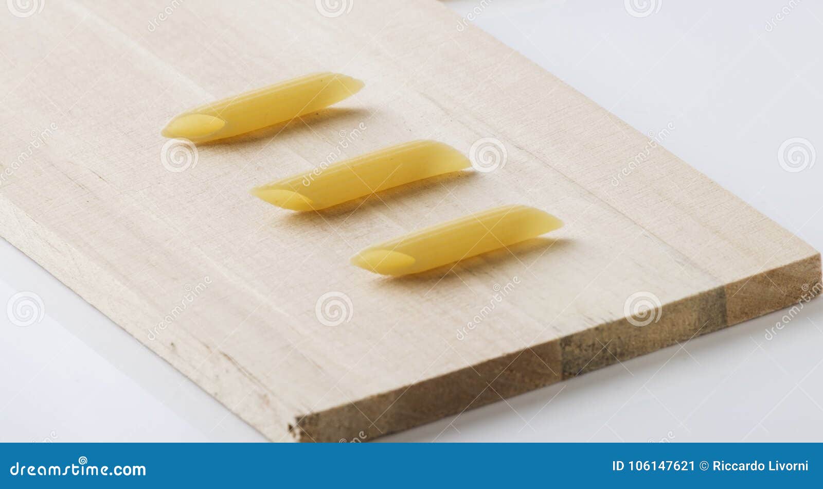 Pasta Penne on Cutting Board Stock Image Image of spoon, penne 106147621