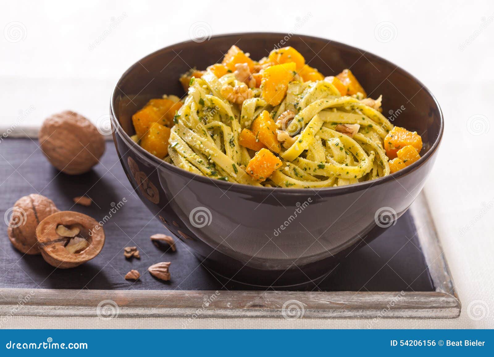 Pasta, pumpkin and pesto stock photo. Image of nutrition 54206156