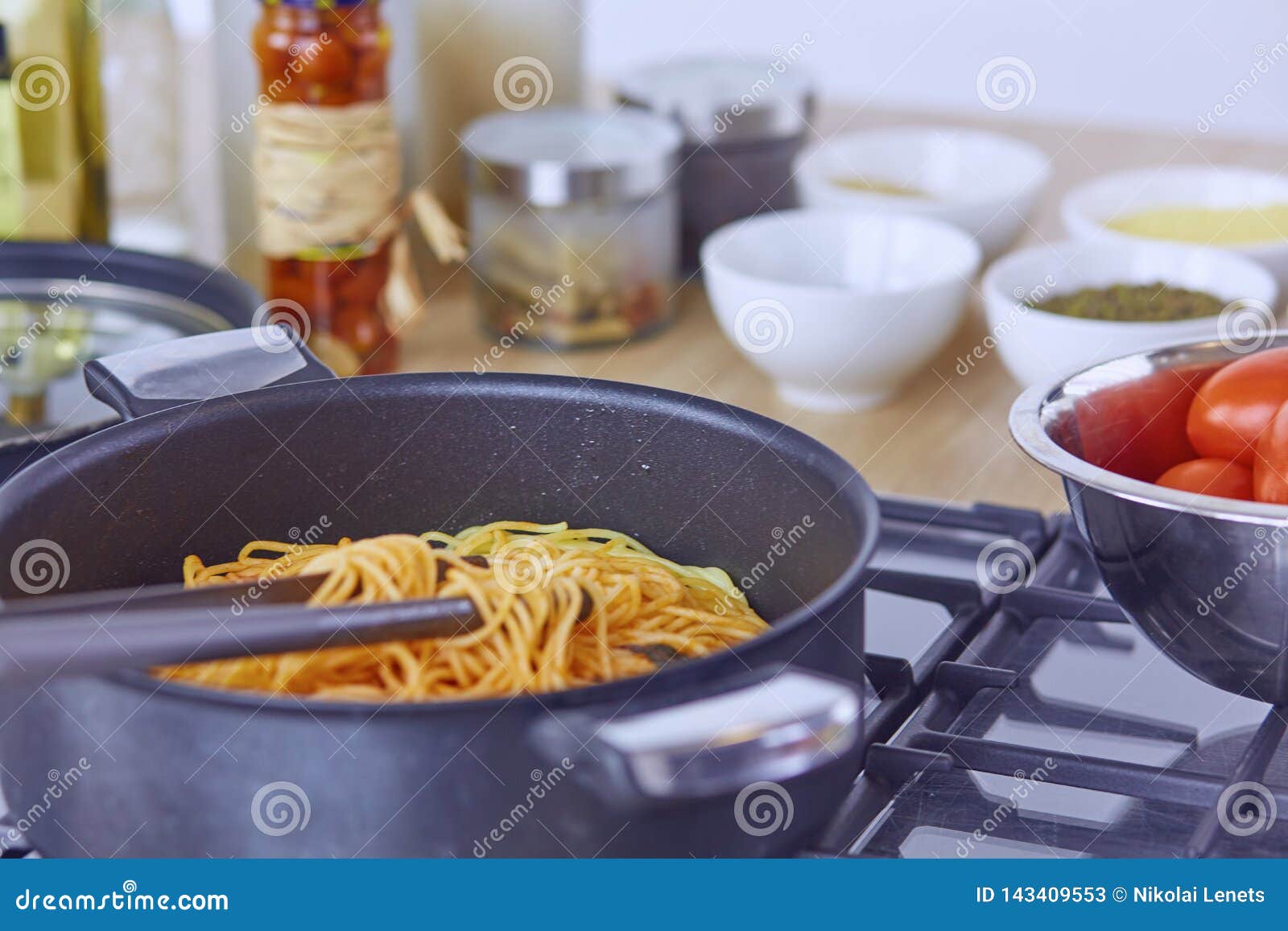 Pasta Rolled on Fork Over Pan on Stove in the Kitchen Stock Image Image of meal, cooking