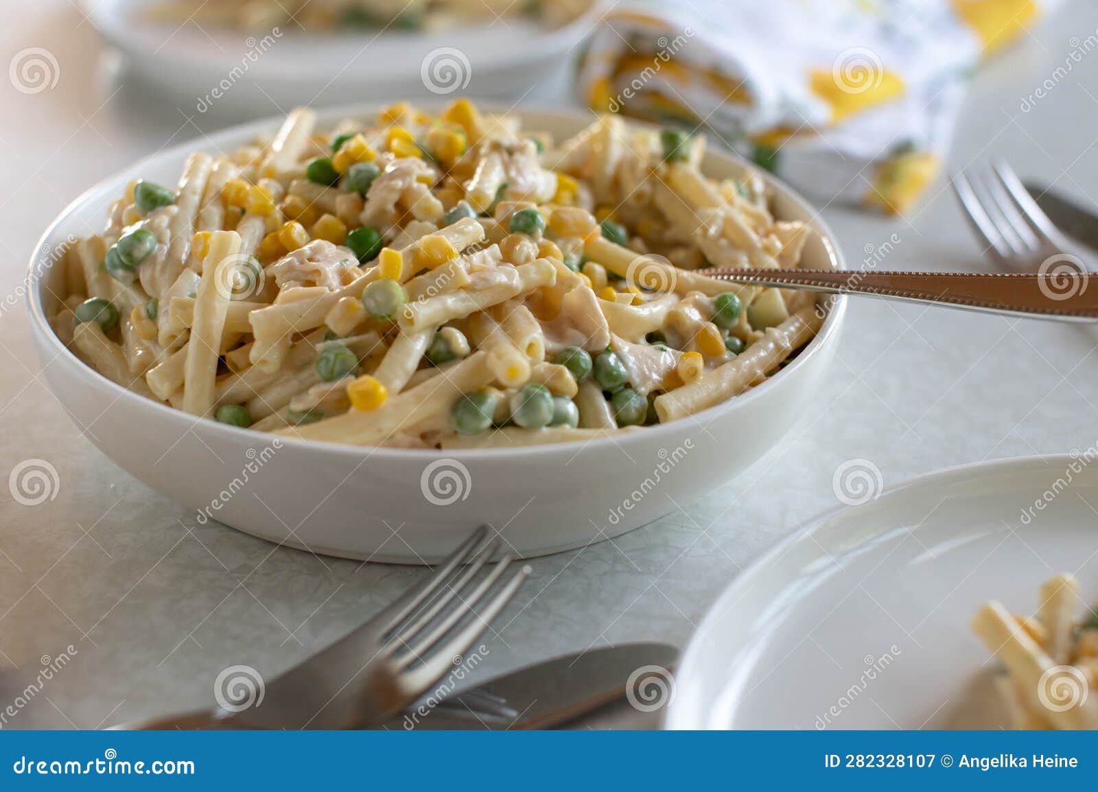 Pasta Salad with Mayonnaise, Corn, Green Peas, Ham and Boiled Eggs in a