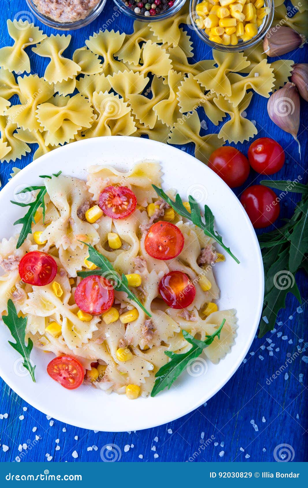 Pasta Salad with Tomatoes Cherry, Tuna, Corn and Arugula. Top View
