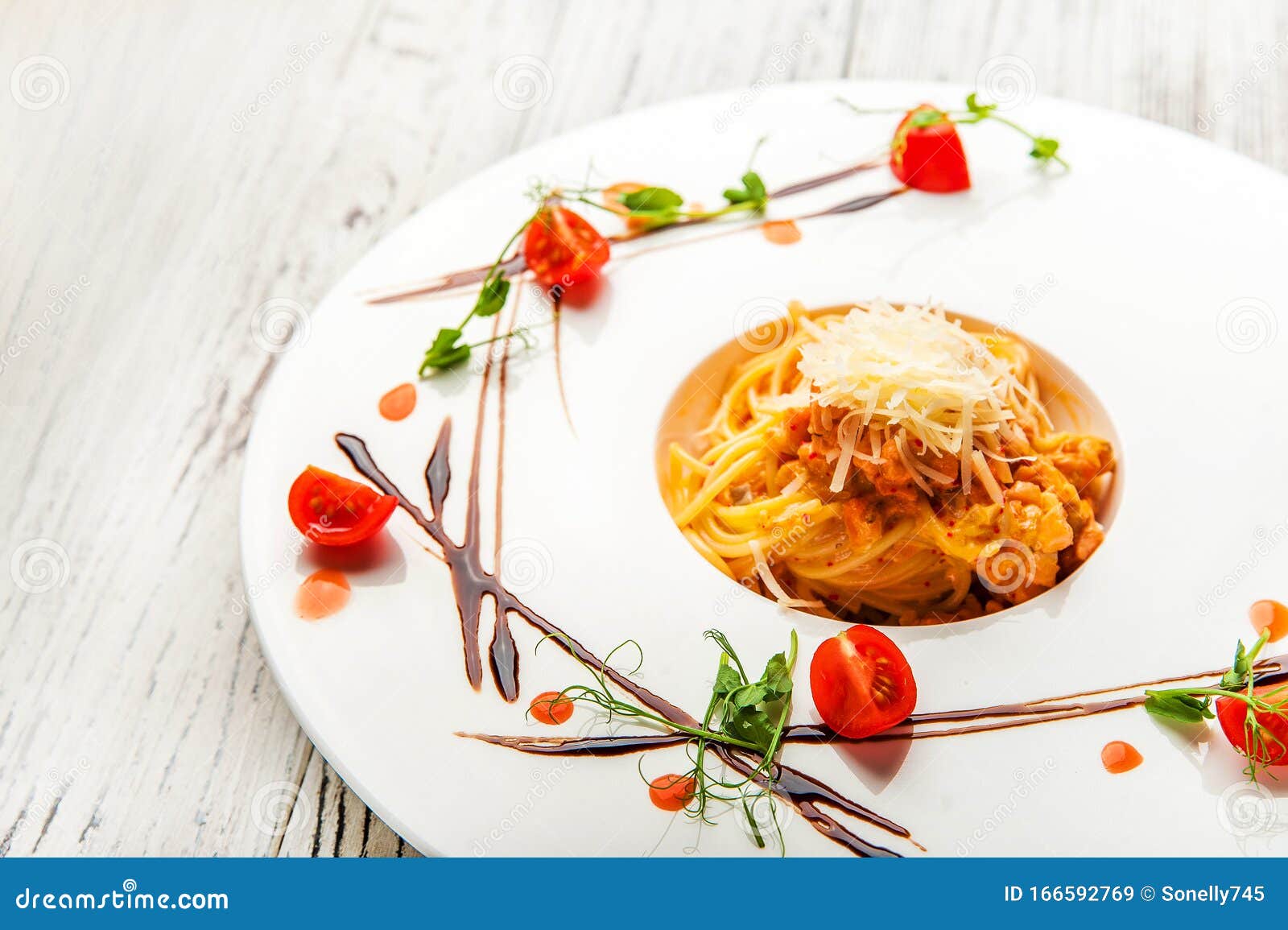 Pasta with Sauce and Tomatoes in a Restaurant Close-up. Italian Pasta