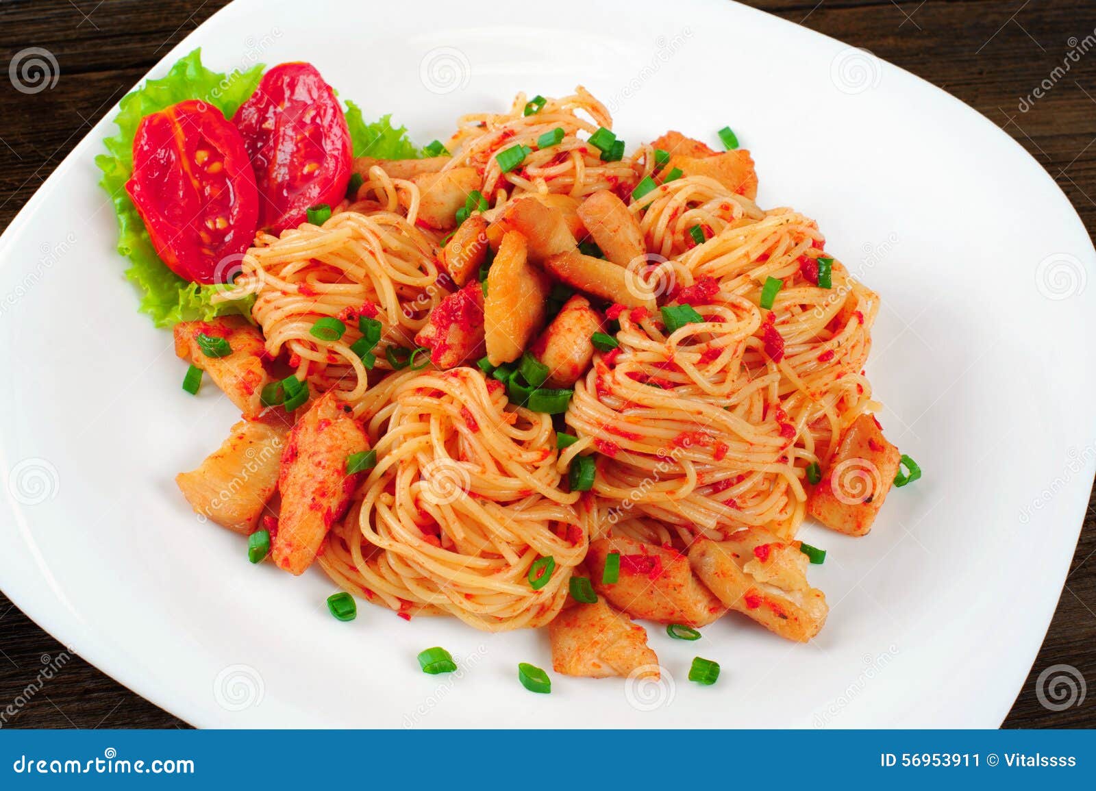 Pasta. Spaghetti with Sauce and Chicken on a Plate Stock Image - Image