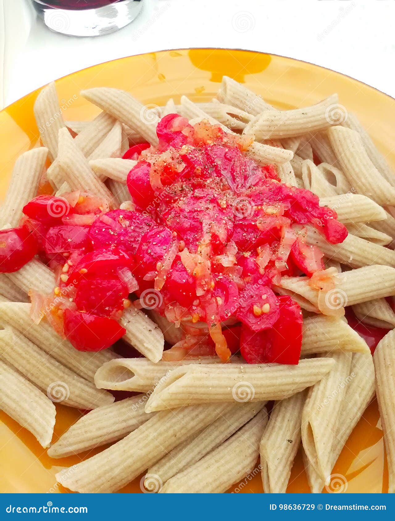 Pasta with Tomato Sauce on a Orange Ceramic Plate Stock Image Image
