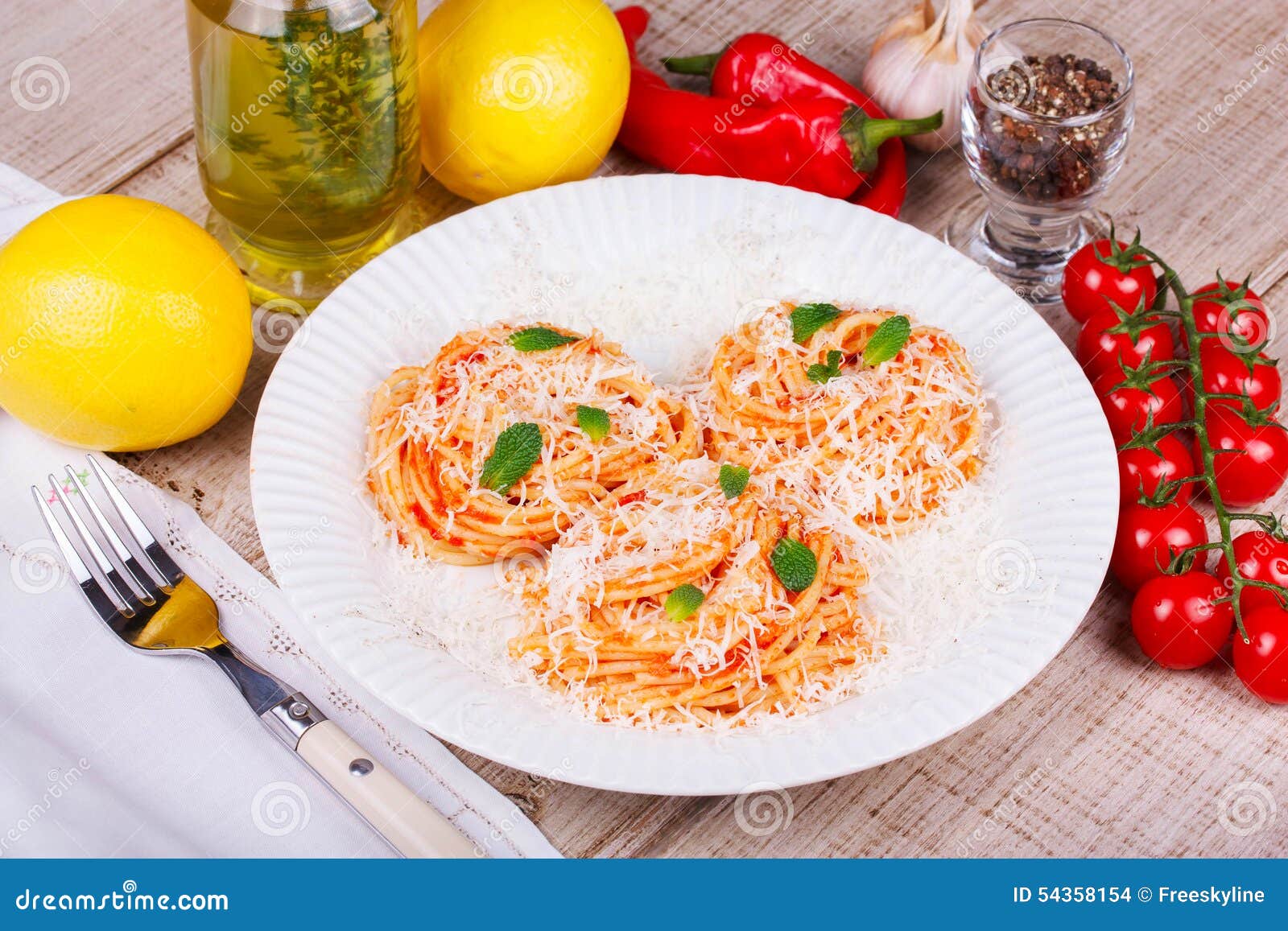 Pasta with Tomato Sauce, Parmesan Cheese and Mint. Stock Photo Image