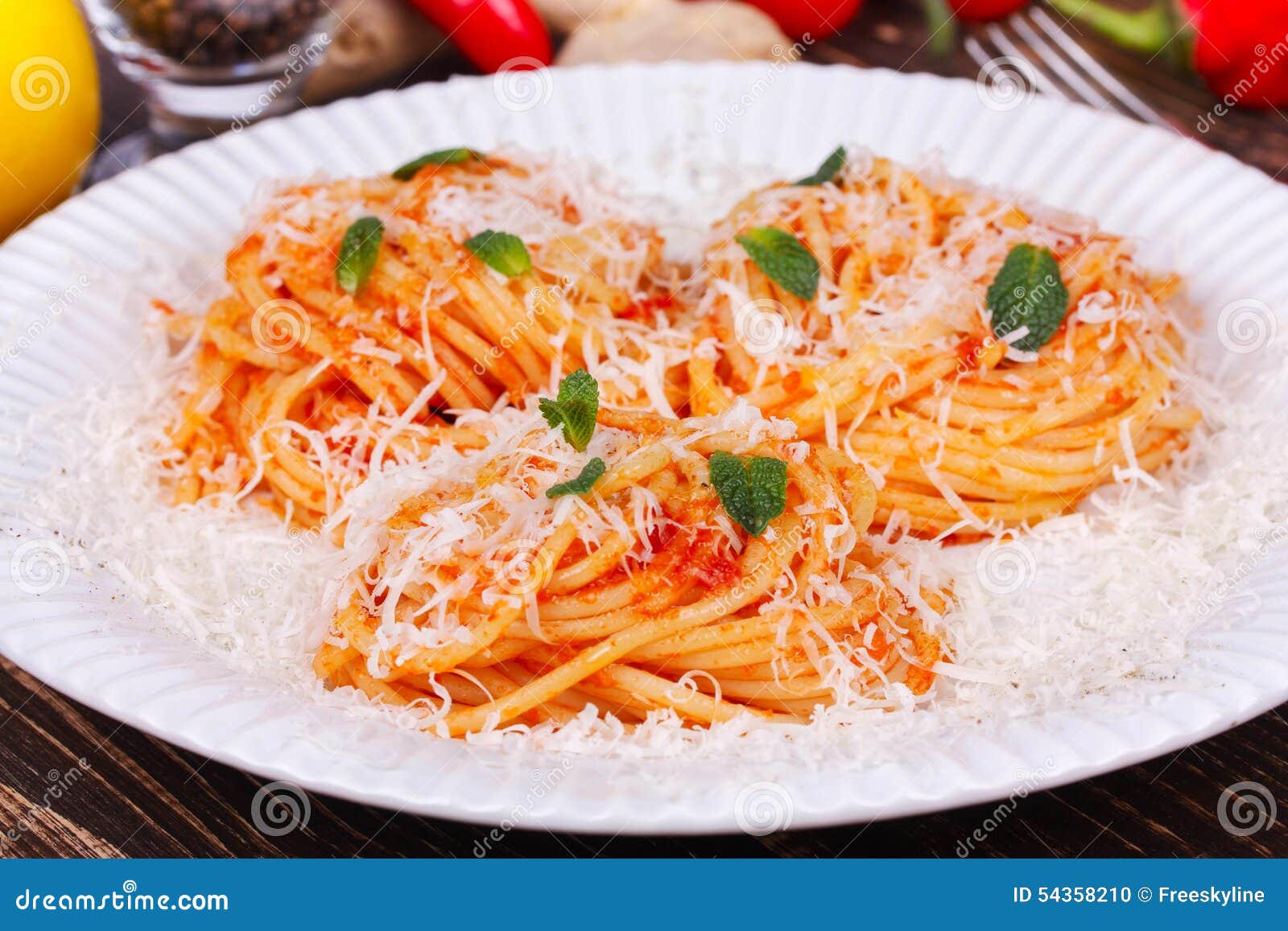 Pasta with Tomato Sauce, Parmesan Cheese and Mint. Stock Photo Image