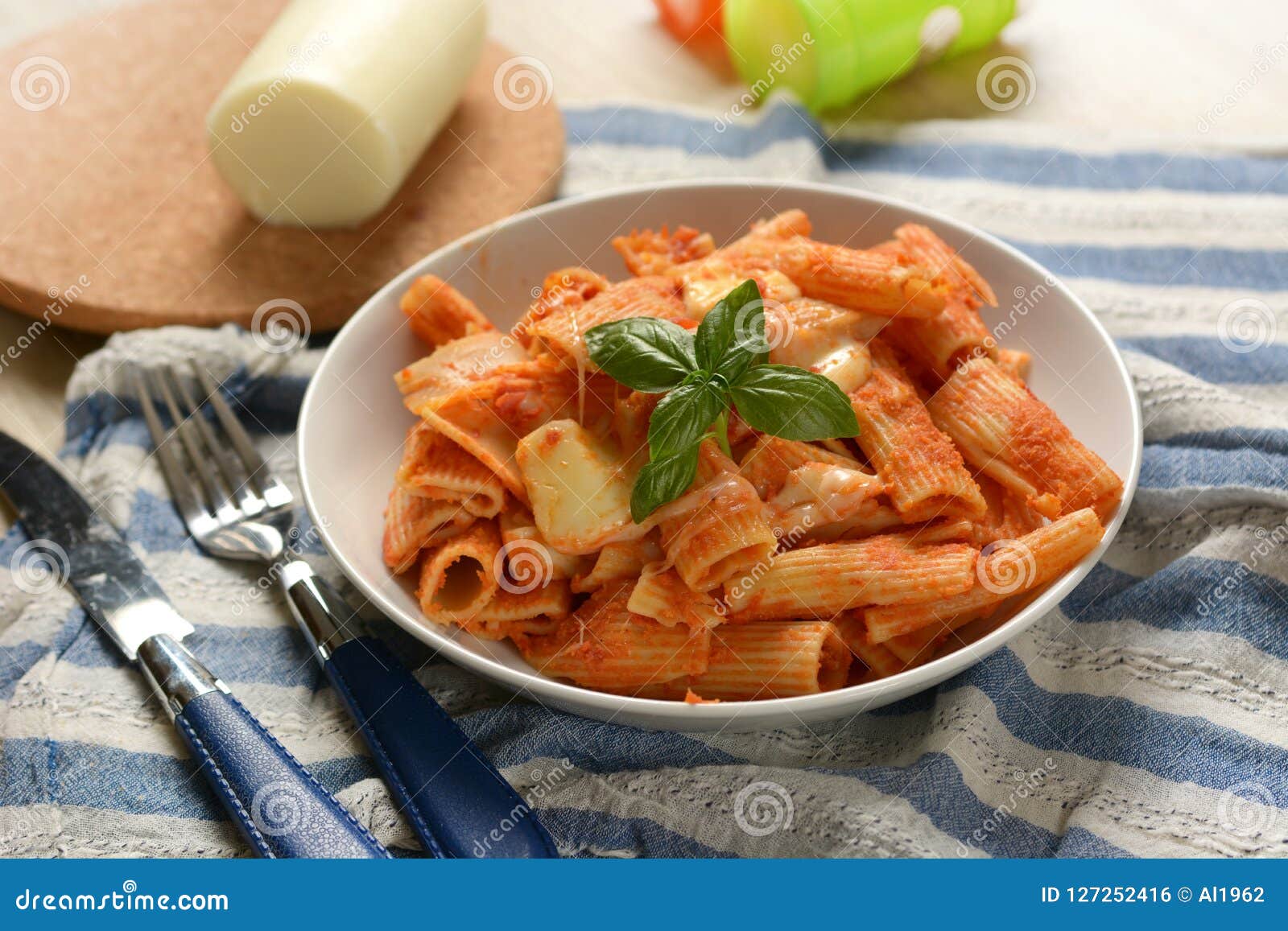 Pasta with Tomato Sauce with Pieces of Melted Cheese Stock Photo
