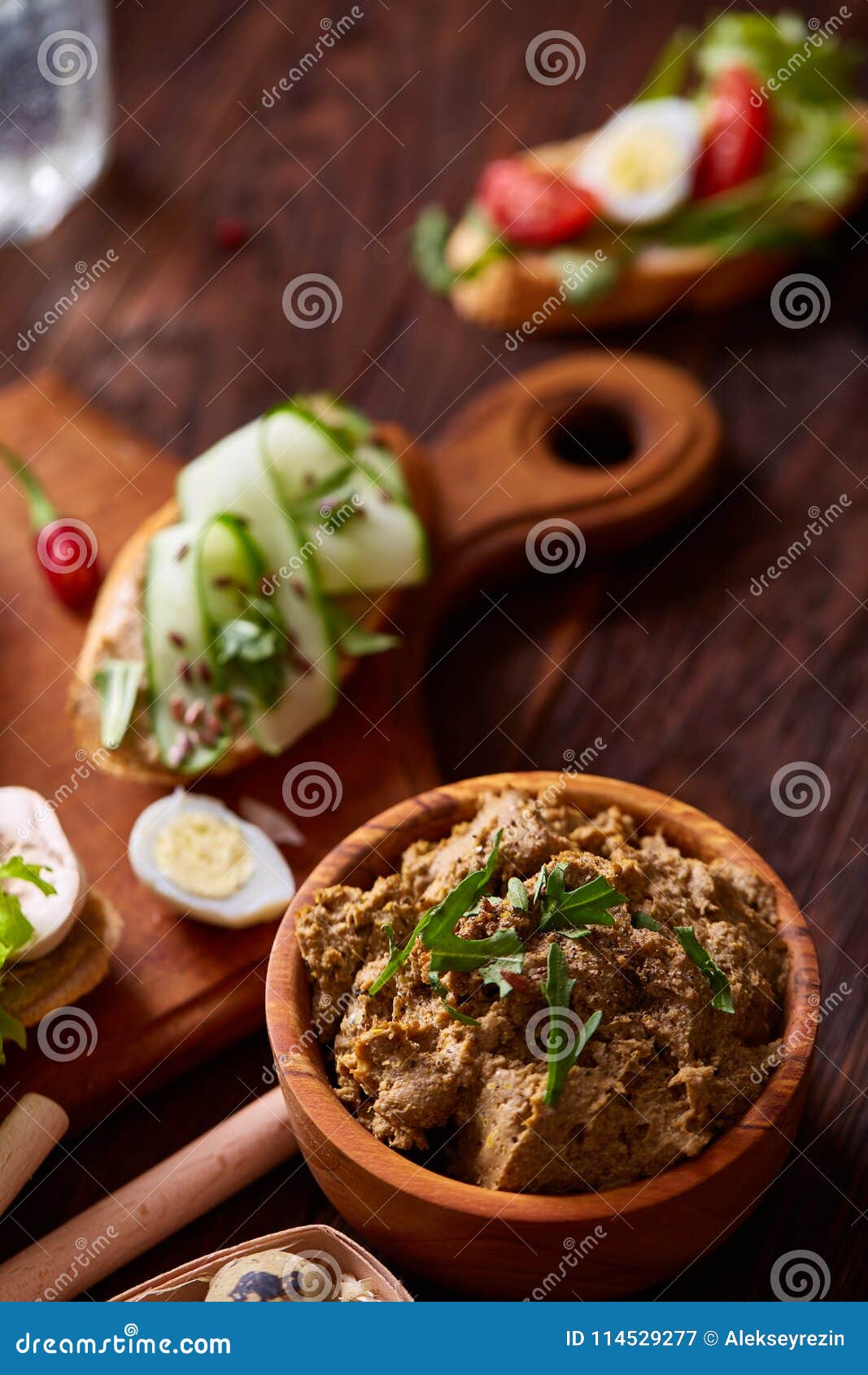 paste from chicken liver with vegetables and quail eggs, shallow depth of field, close-up.