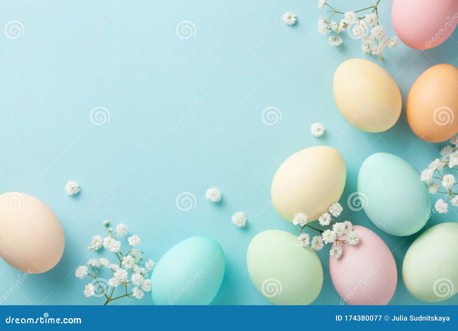 Pastel Easter Eggs on Blue Background Top View. Flat Lay Style Stock