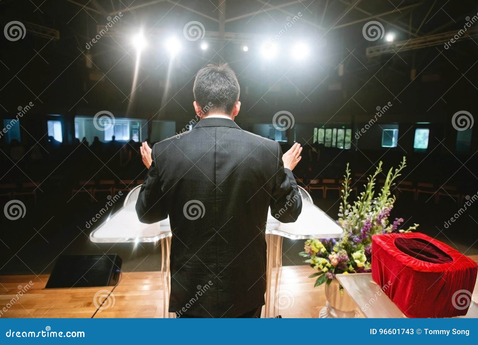 pastor praying for congregation