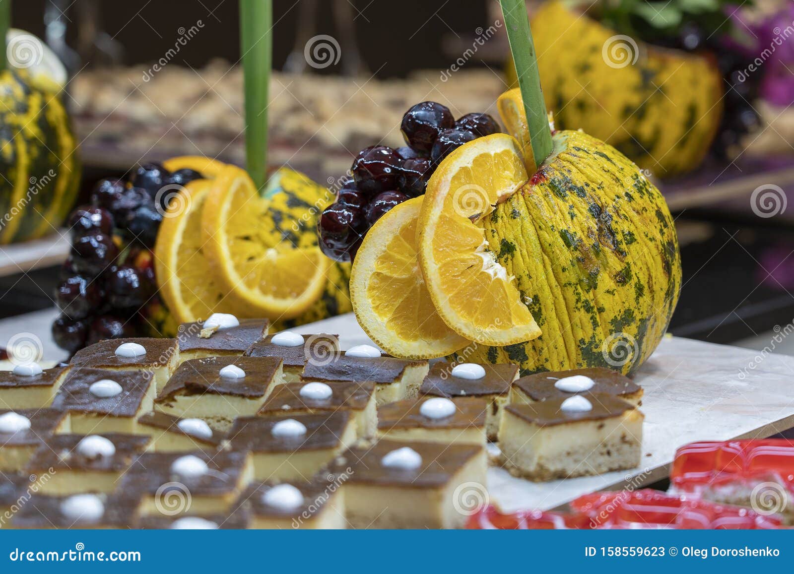 Pastries, Sweet Dessert And Decorated Fruit In The Dining Room At The
