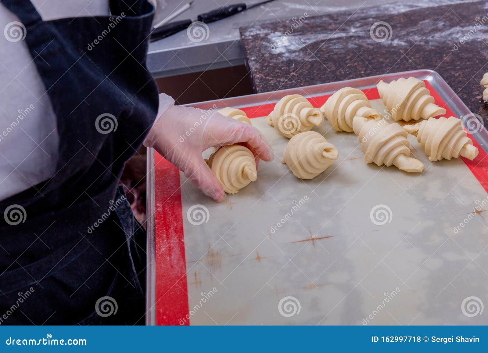 Blanks For Baking Cinnamon Rolls On Baking Sheet With Parchment Paper