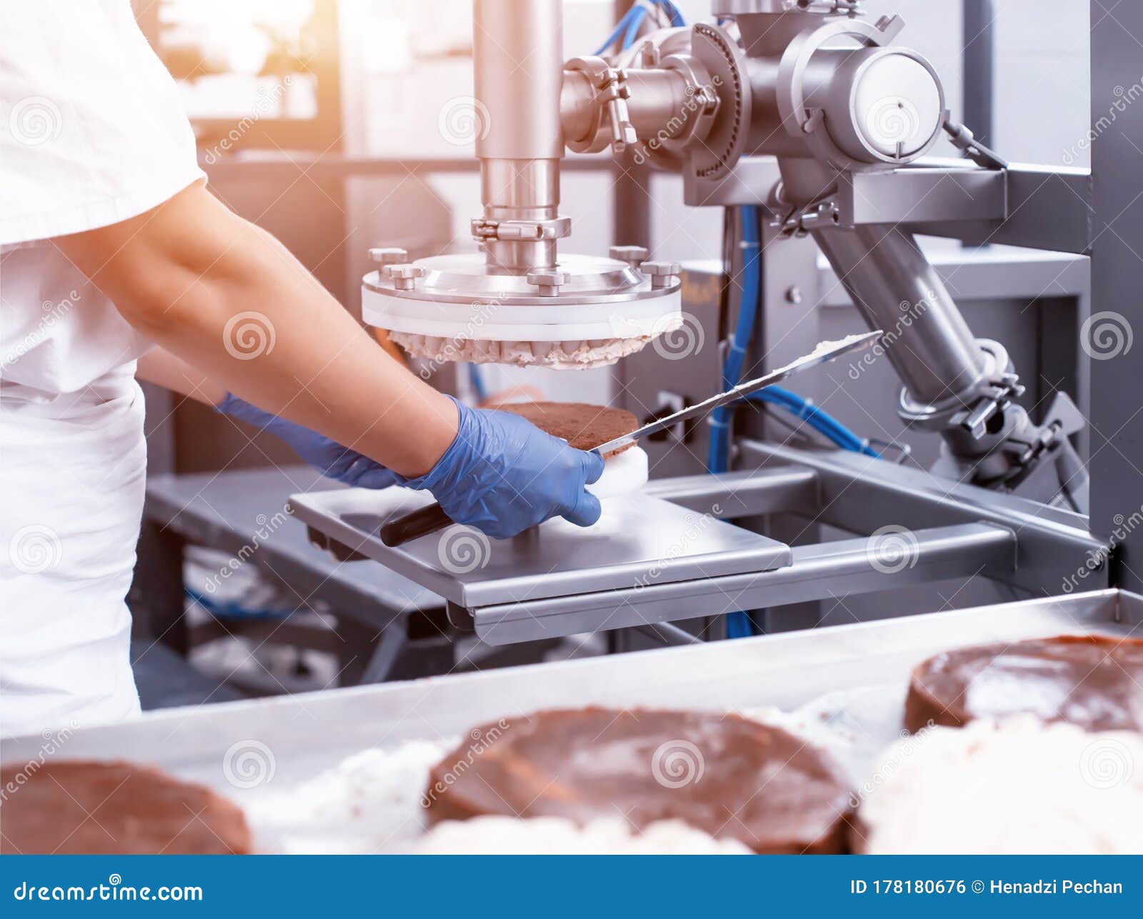 The Pastry Chef Makes Cake Using Modern Equipment for the Production of