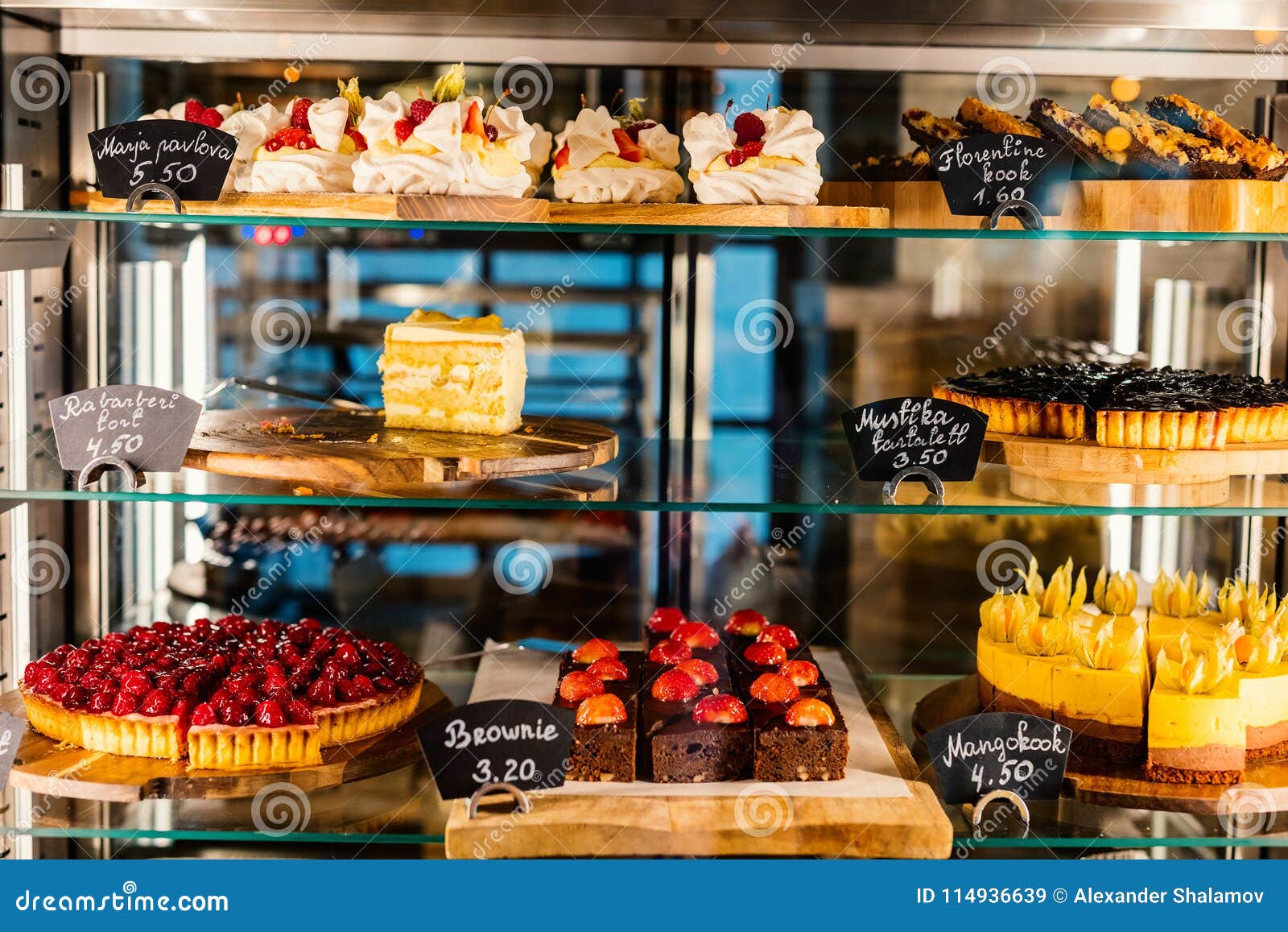 Pastry shop glass display stock image. Image of closeup - 114936639