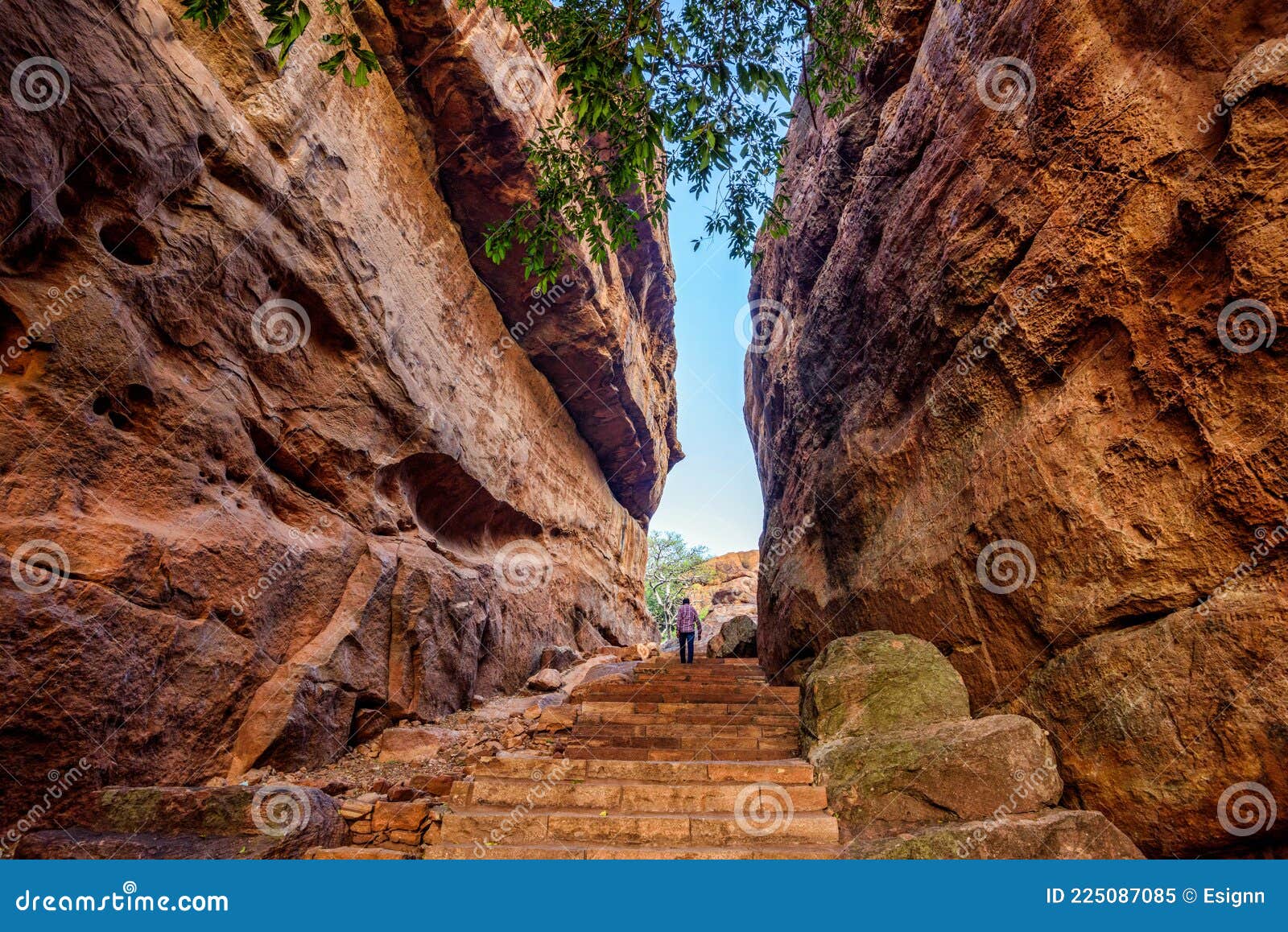 path through steep cliffs, entrance for lower and upper shivalaya in badami, karnataka, india