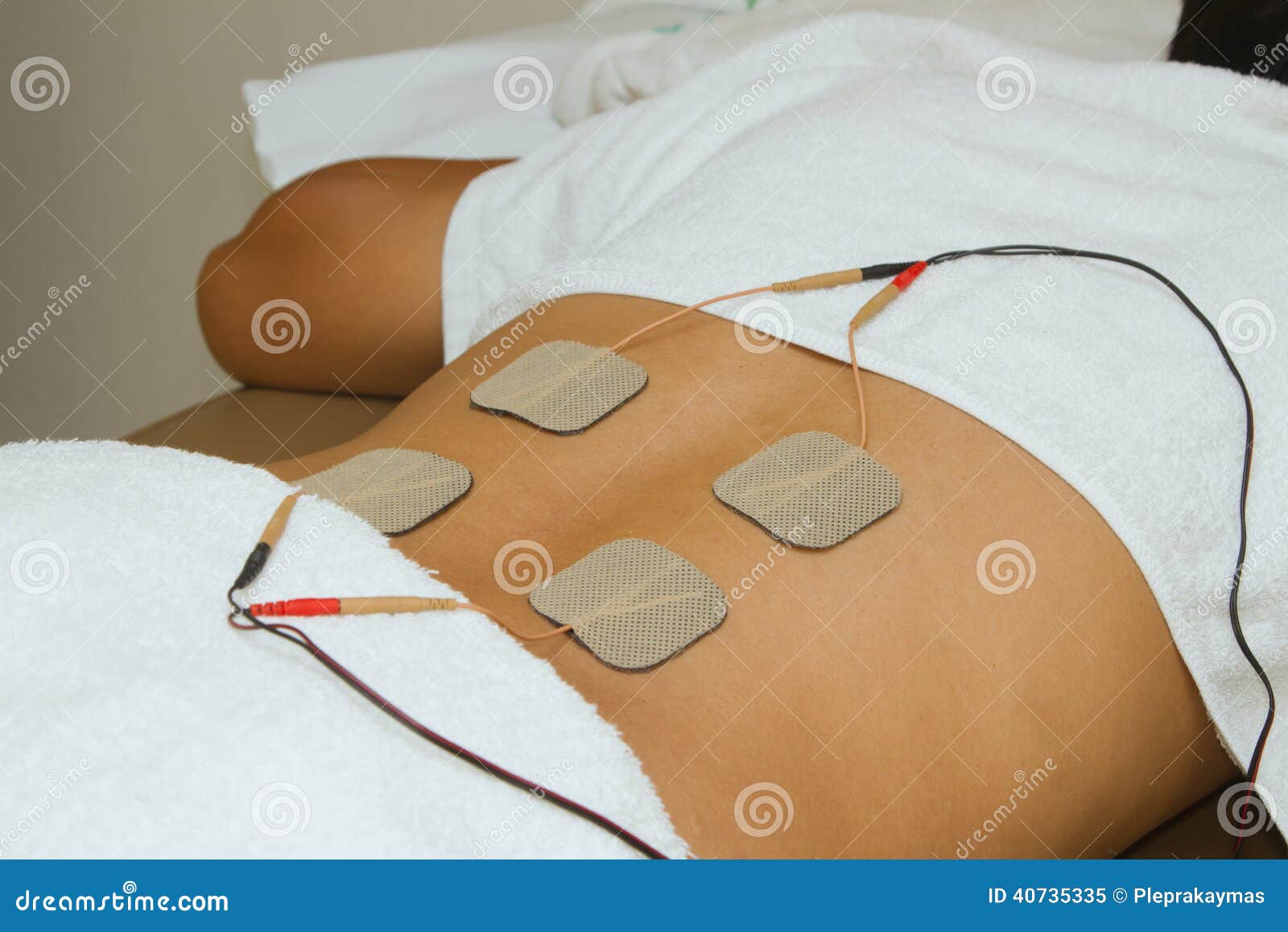 Patient Applying Electrical Stimulation Therapy ( TENS ) Stock Image