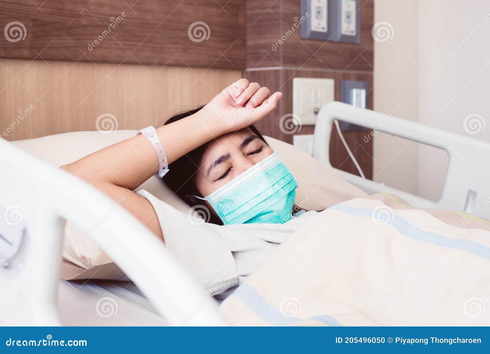 patient asian woman having a headache or migraine severe in hospital,dengue fever
