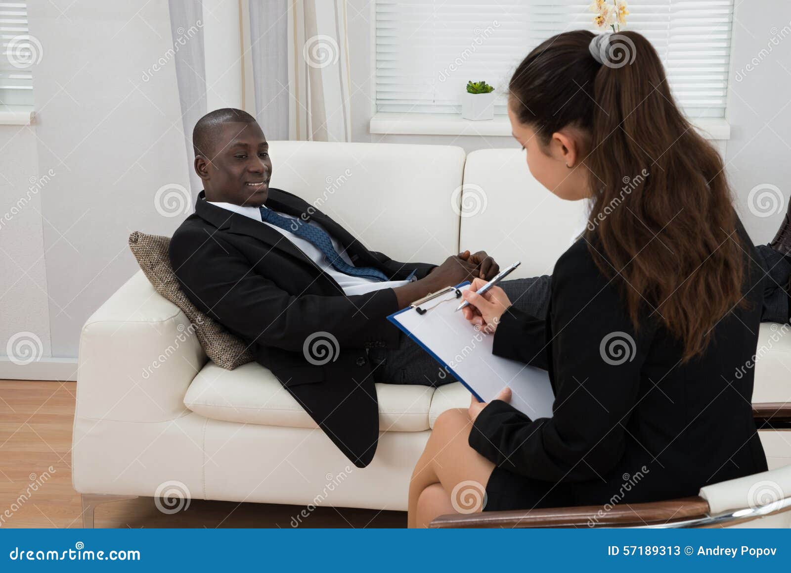 Patient in Front of Psychiatrist Taking Notes Stock Image Image of