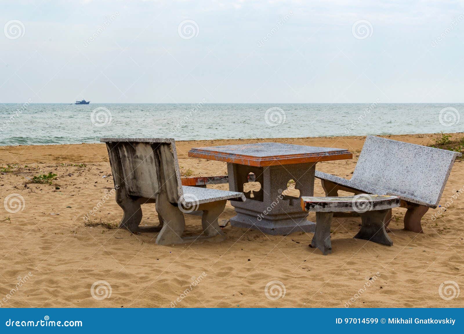 Patio with Stone Furniture, Chairs and Table on Sandy Beach Stock Image