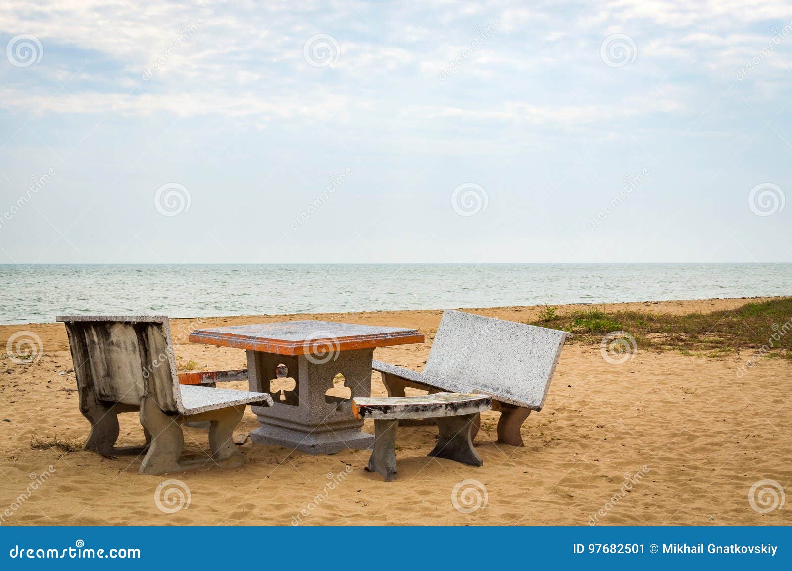 Patio with Stone Furniture, Chairs and Table on Sandy Beach Stock Image