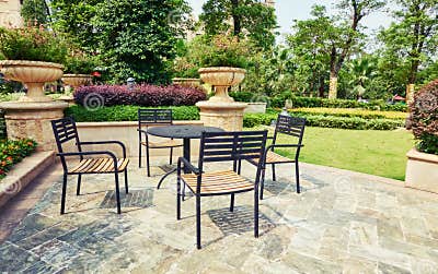 Outdoor Backyard Patio in Landscaping Garden with Furniture Stock Photo