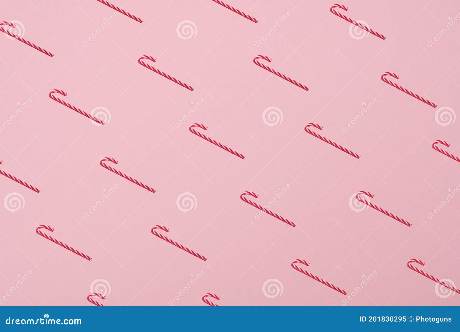 Pattern of Candy Canes on Pastel Pink Background. Minimal Style Stock