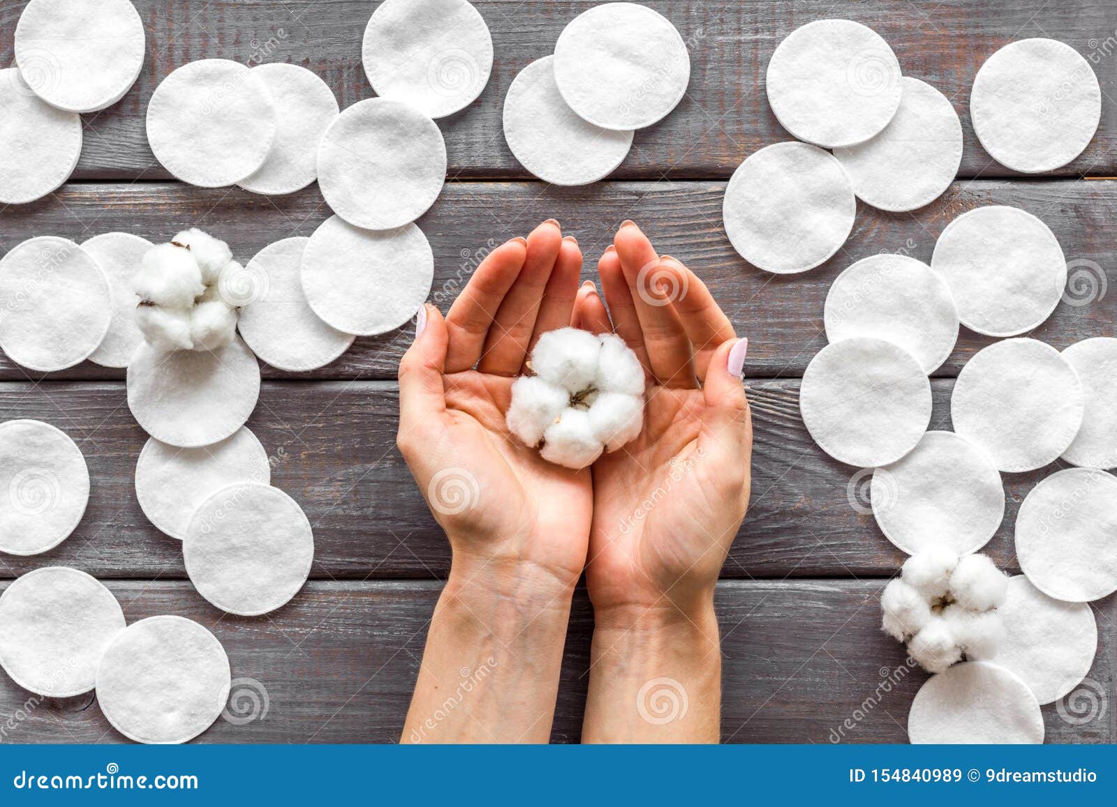 Download Pattern Of Cosmetic Cotton Pads, Flower In Hands On Wooden ...