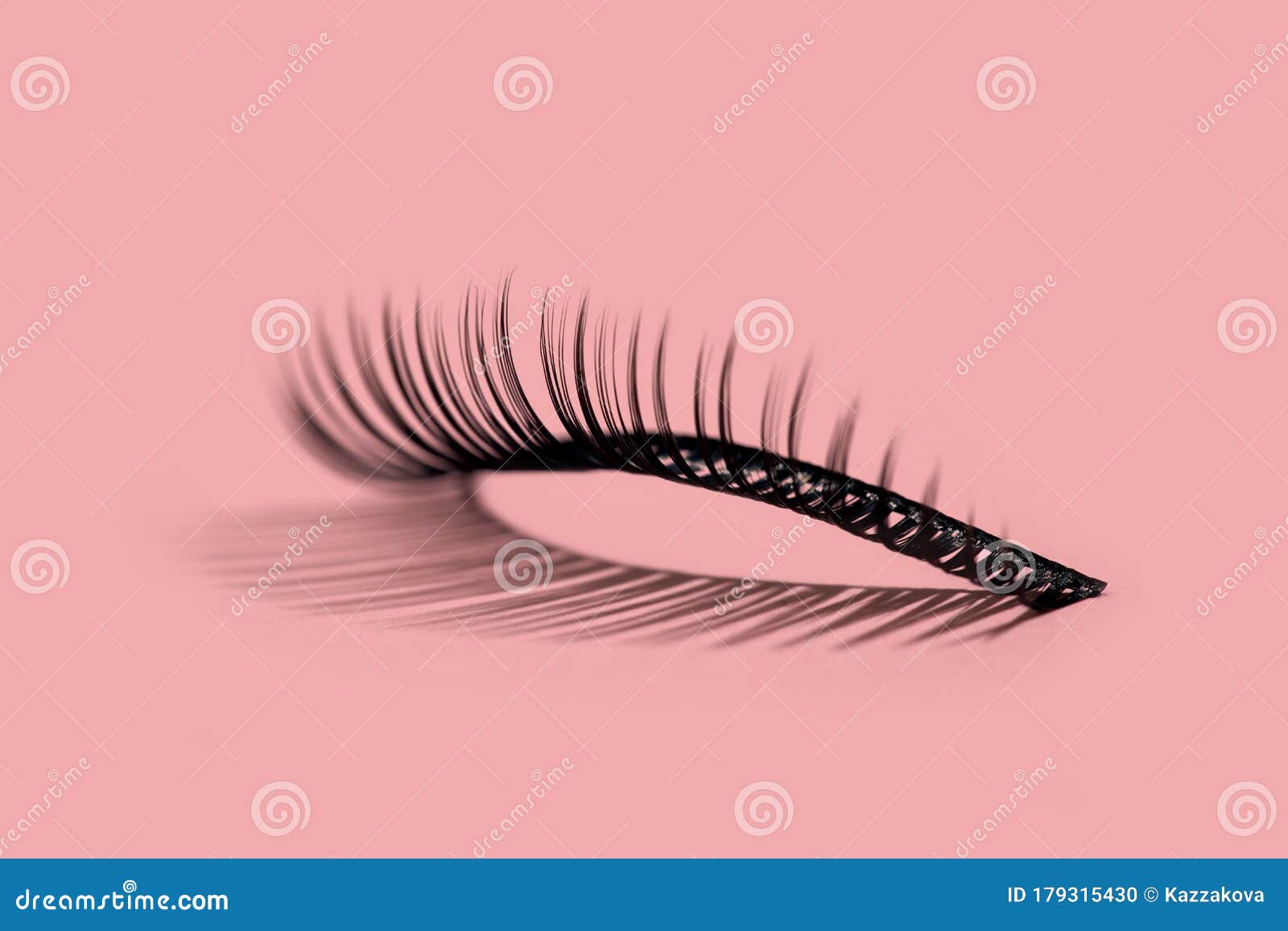 a pattern of false lashes on pink