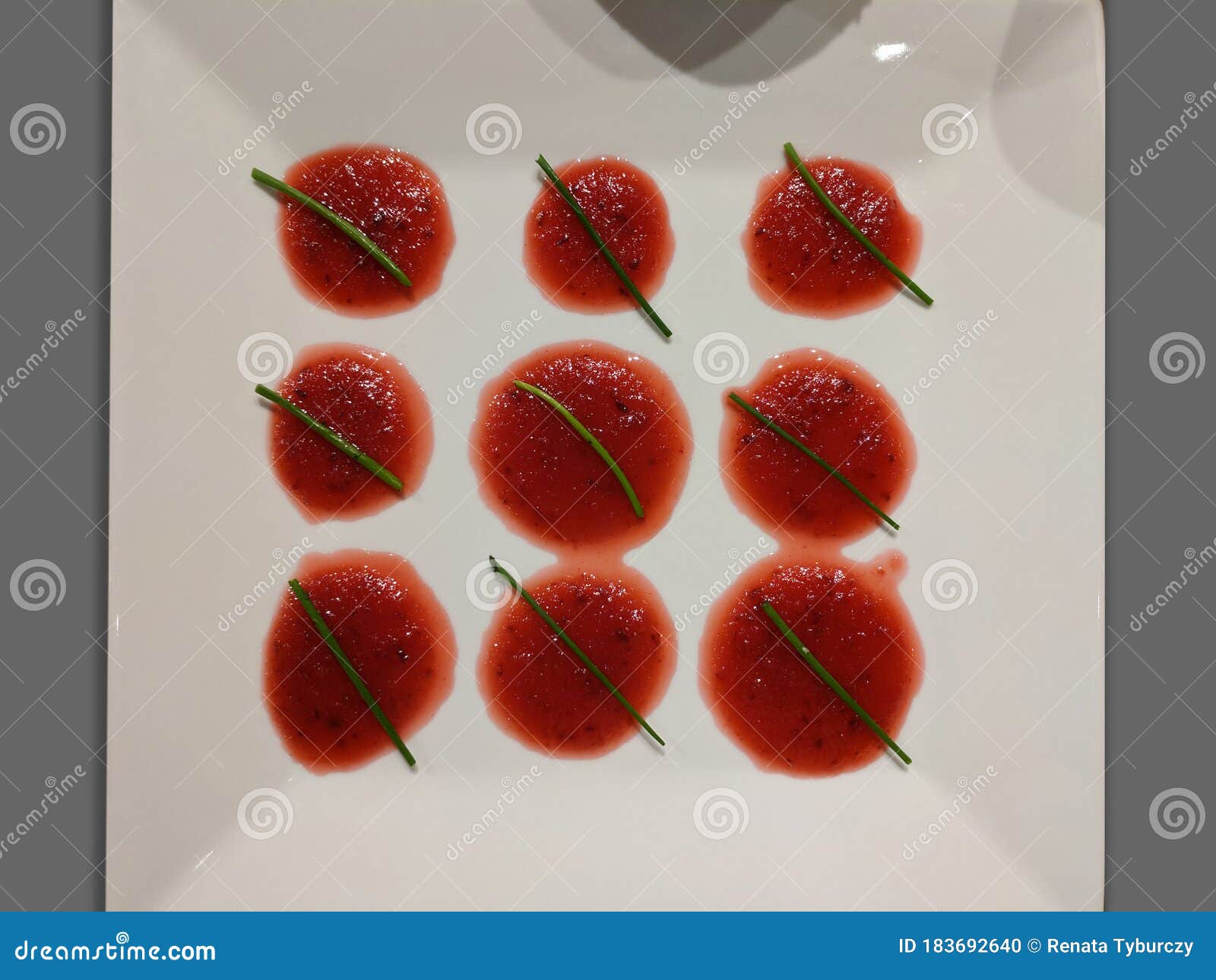 Pattern of Sauce Decoration with Chive on a Plate Dish Stock Photo