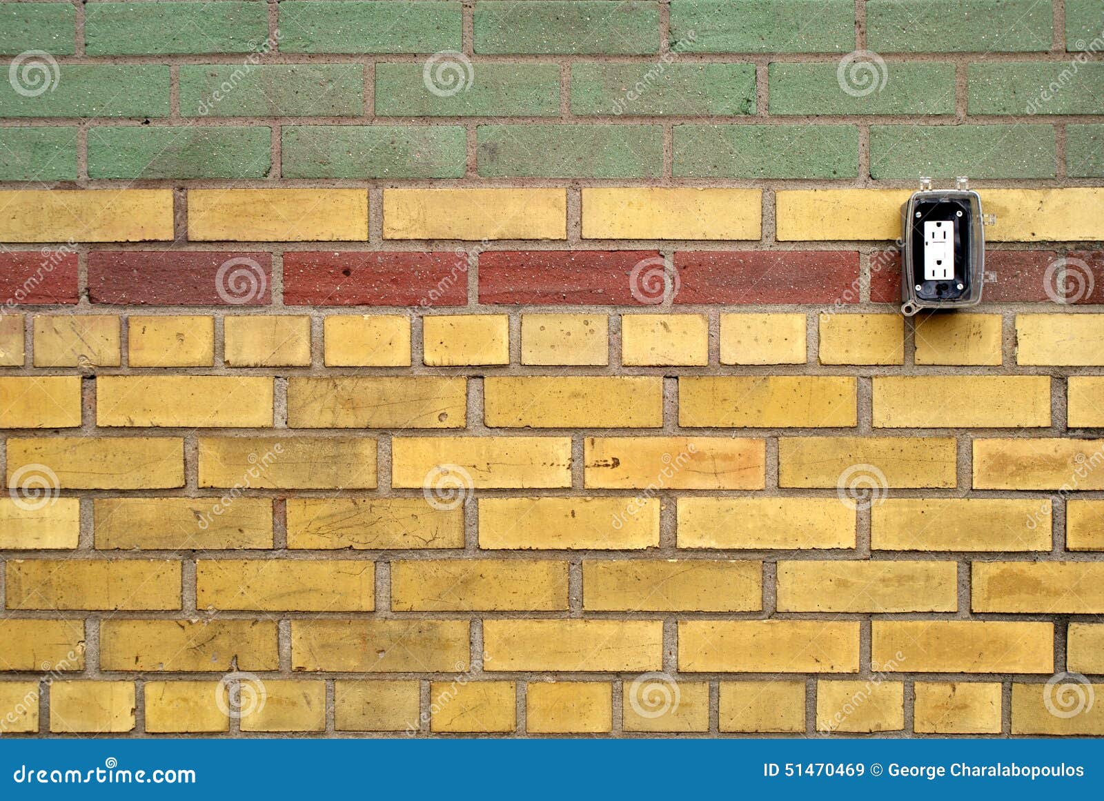 Pattern Wall of Coloured Bricks with Electrical Outlet Stock Image