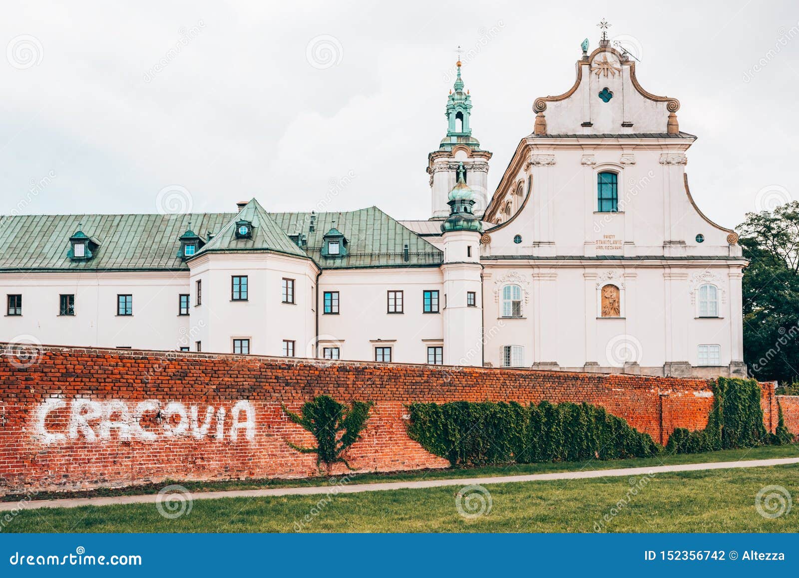 pauline fathers monastery on skalka in krakow with cracovia graffitti on the brick wall.