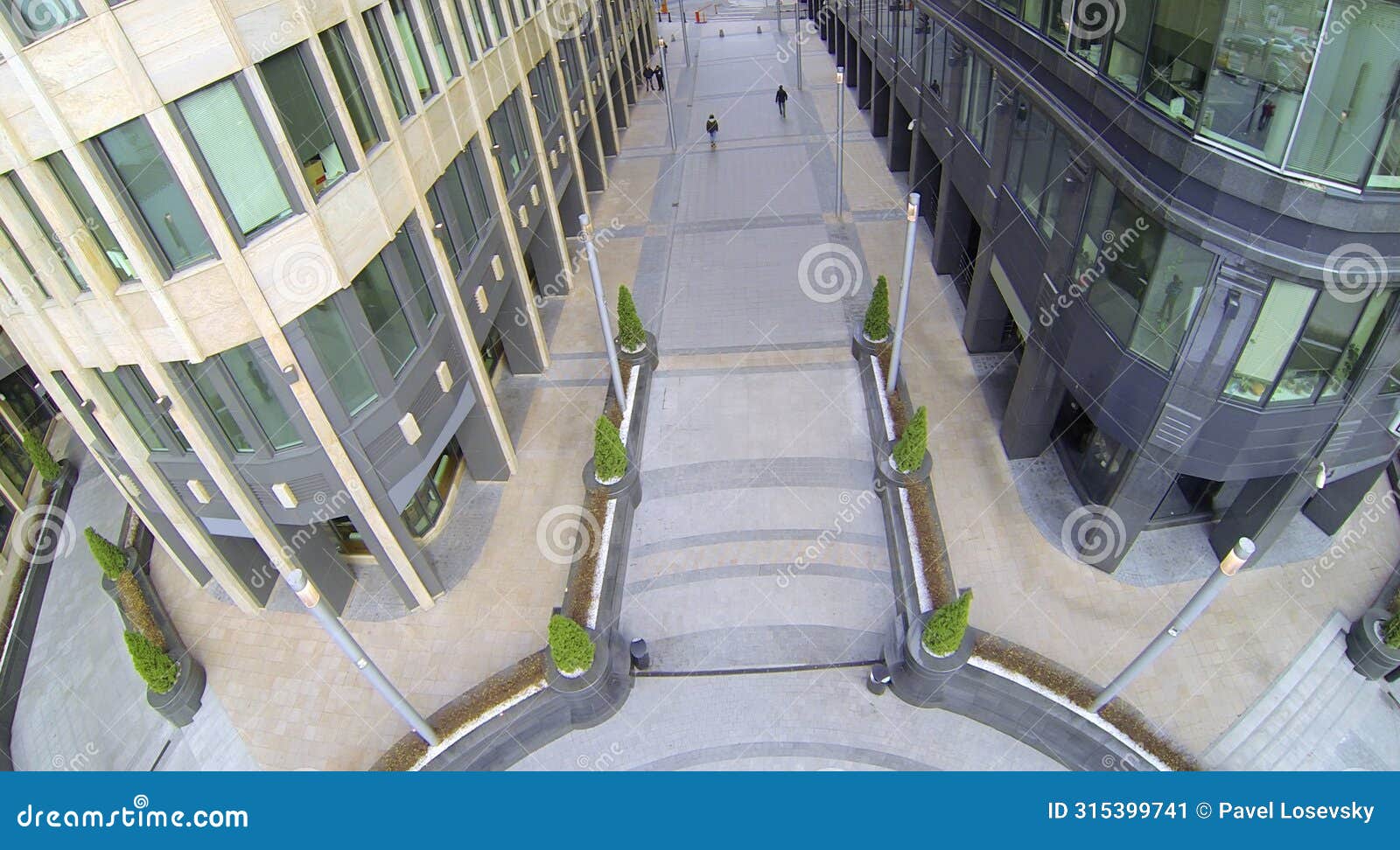 pavement between two office buildings. view from