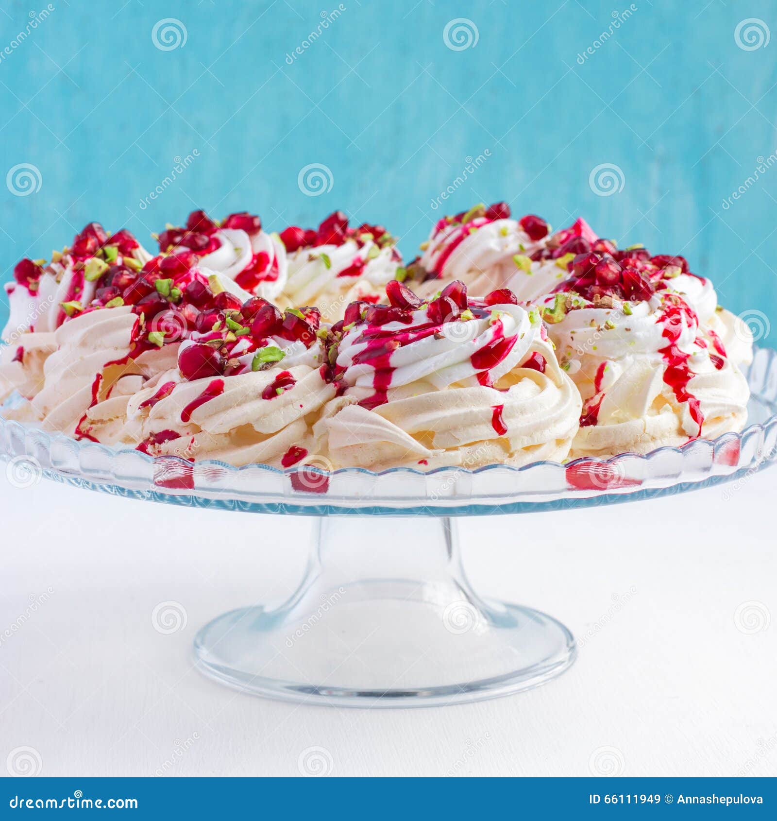 pavlova cake with pomegranate, cranberry and pistachios