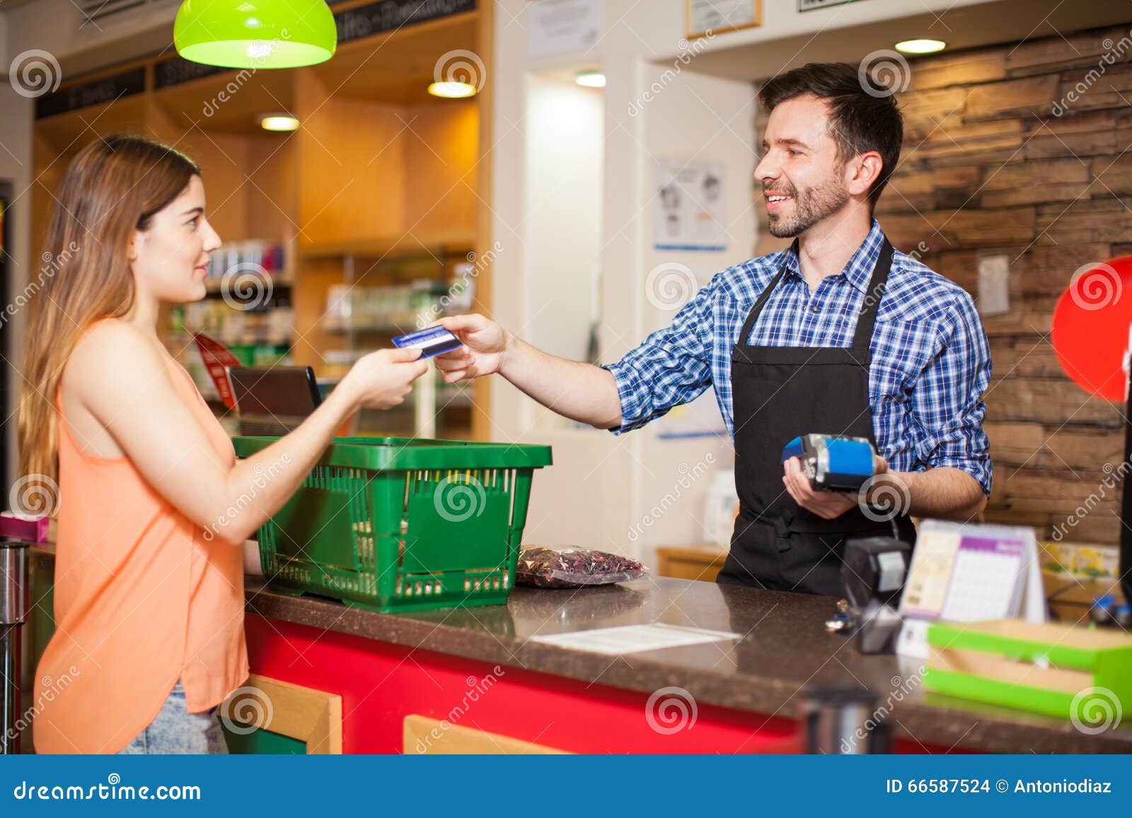 Paying with Credit Card at a Grocery Store Stock Photo - Image of