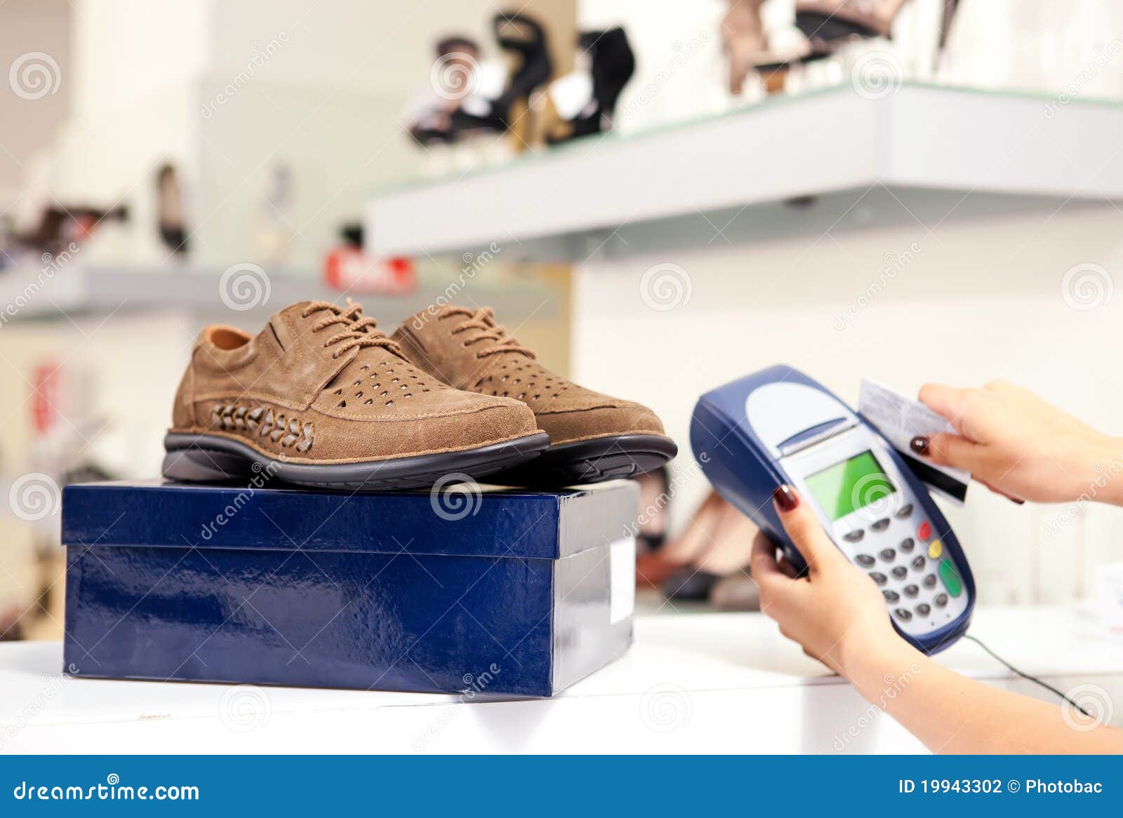 Paying Using Credit Card Terminal In Shoe Store Stock Photo - Image of