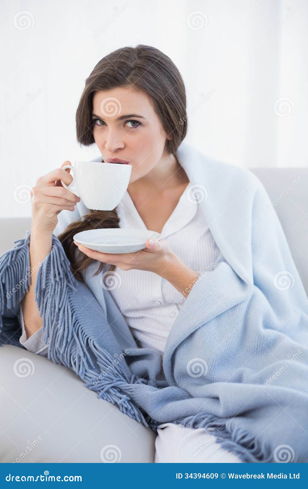 Peaceful Casual Brown Haired Woman in White Pajamas Drinking Coffee ...