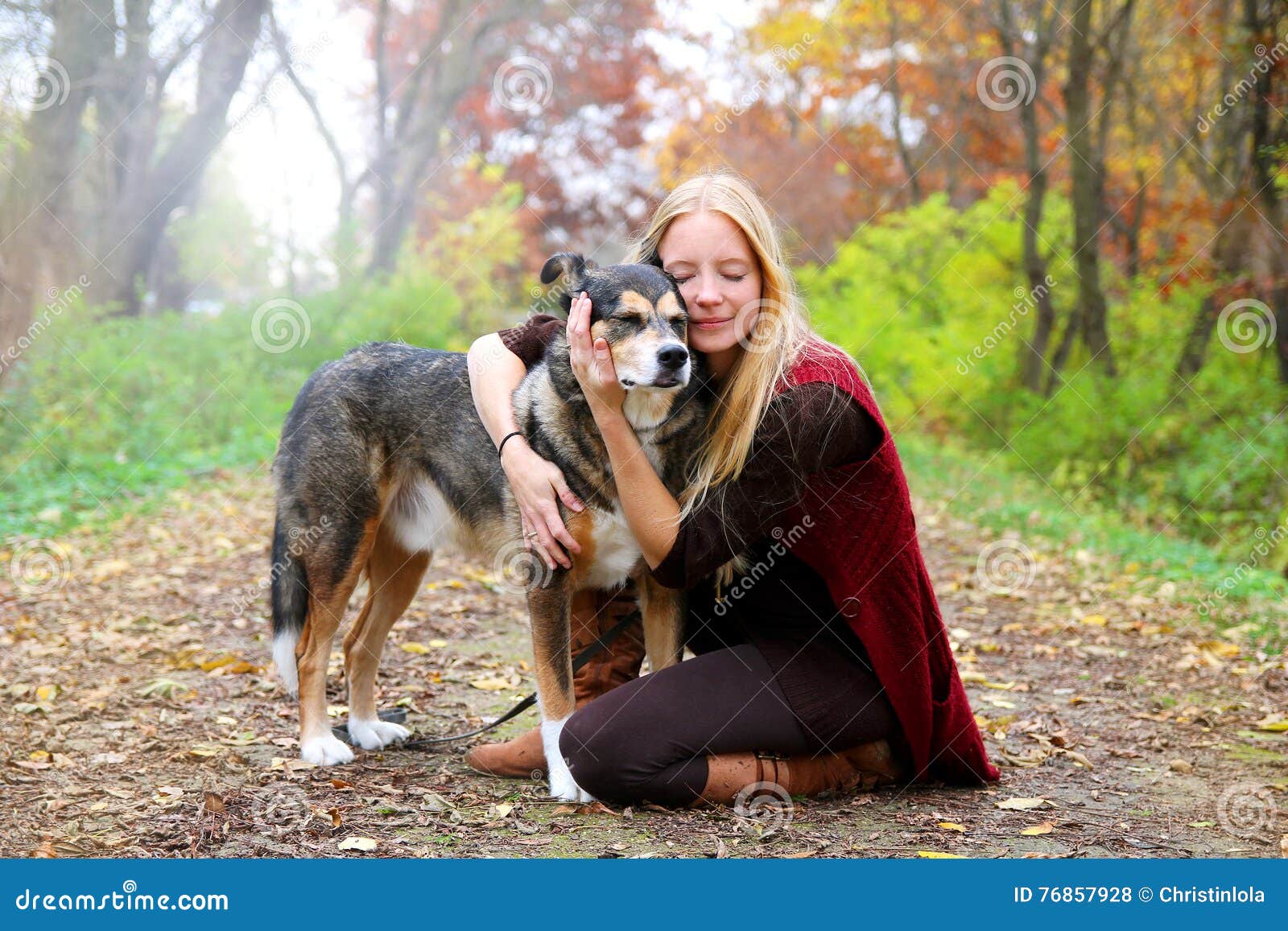 peaceful happy woman hugging german shepherd dog while walking i