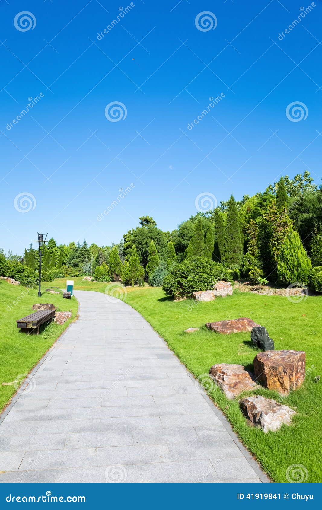 Peaceful park in the morning ,pavement and the sunny sky