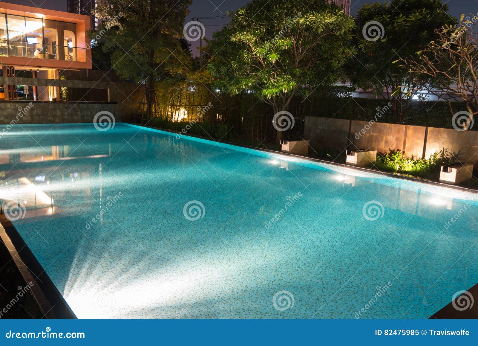 peaceful pool reflections in the evening twilight with warm still water filled to the brim and ready for swimming. bright mood l