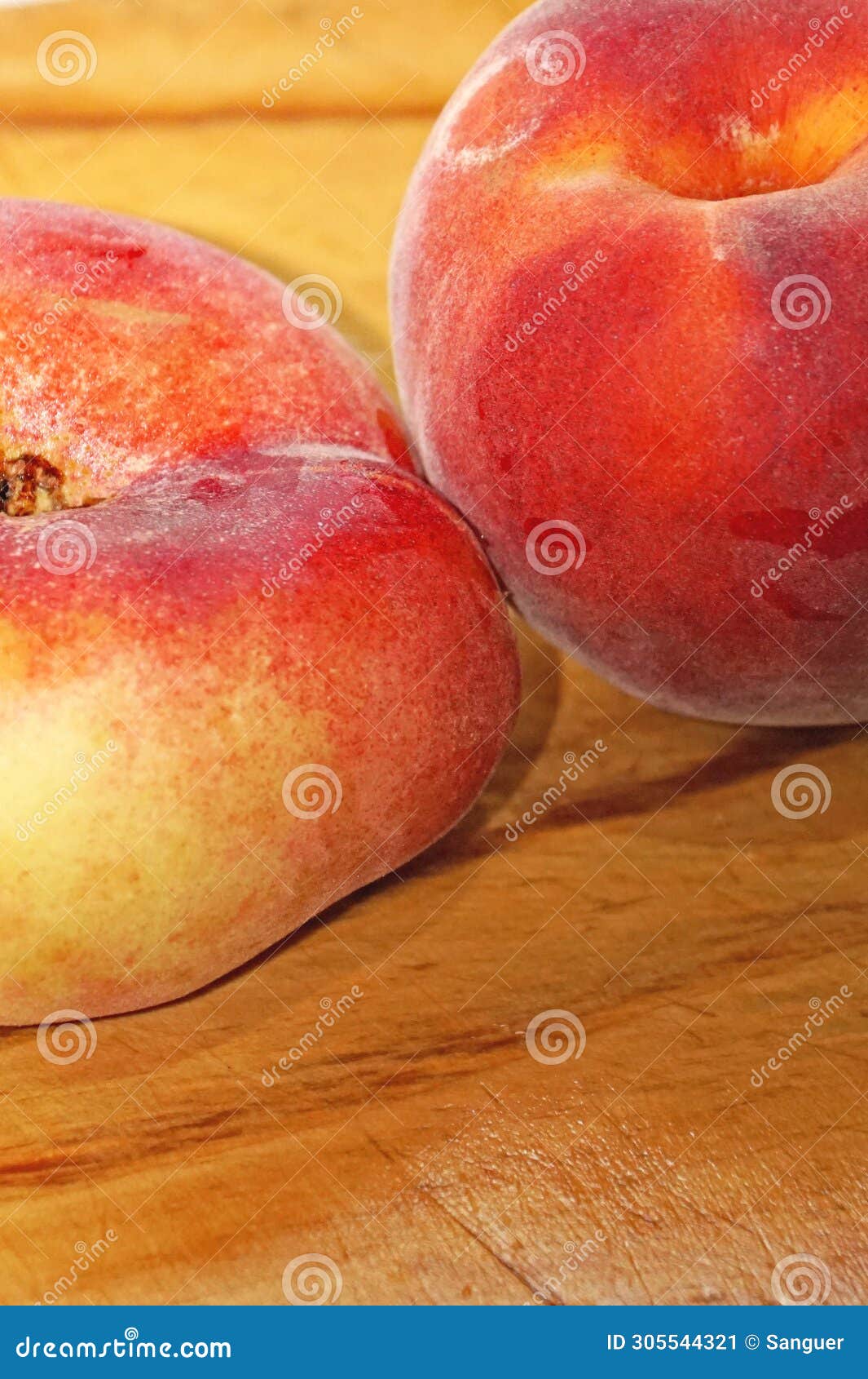 peach and paraguayan on a cutting board in the kitchen