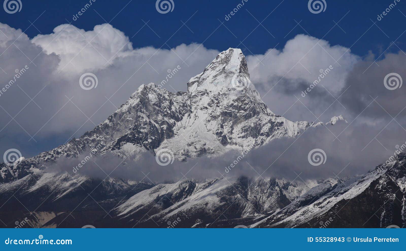 peak of ama dablam surrounded by clouds