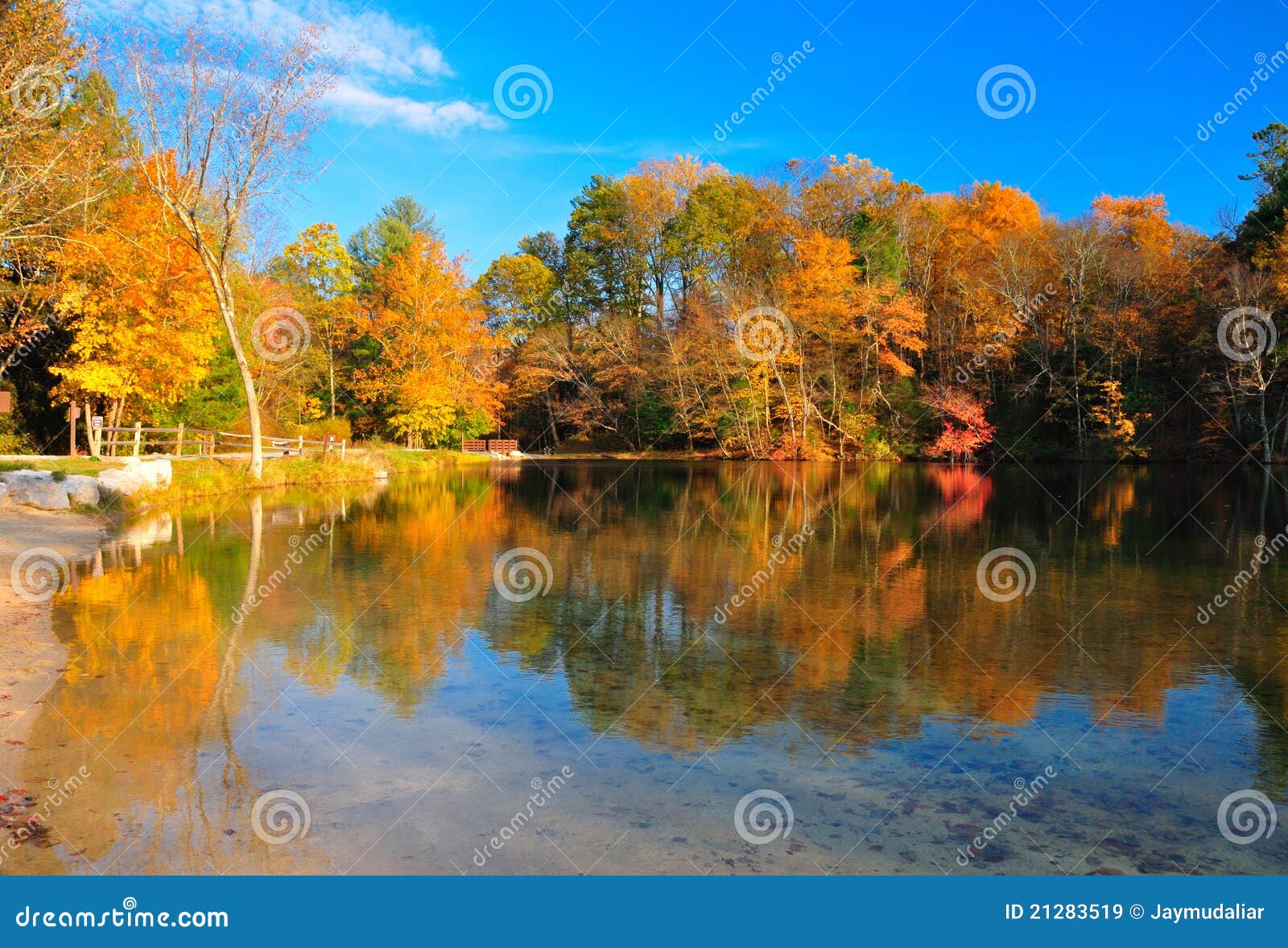 peak fall foliage at a lake