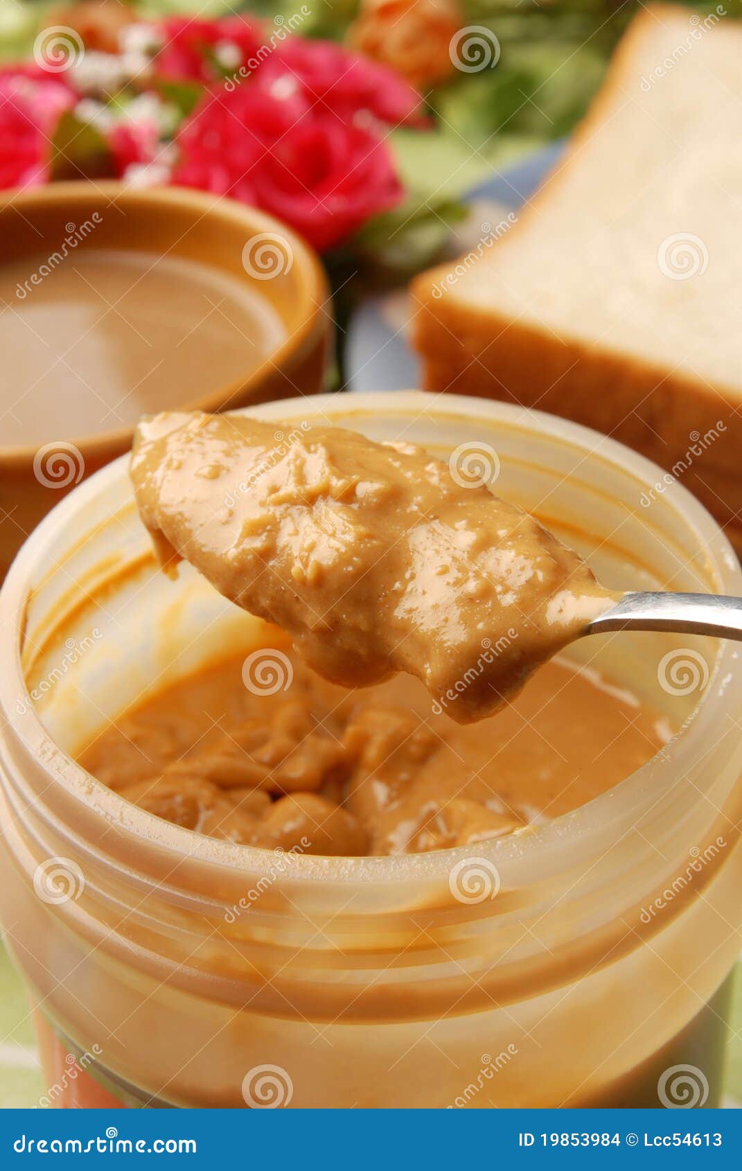 Peanut butter spread on a knife Stock Photo by ©magone 70606539