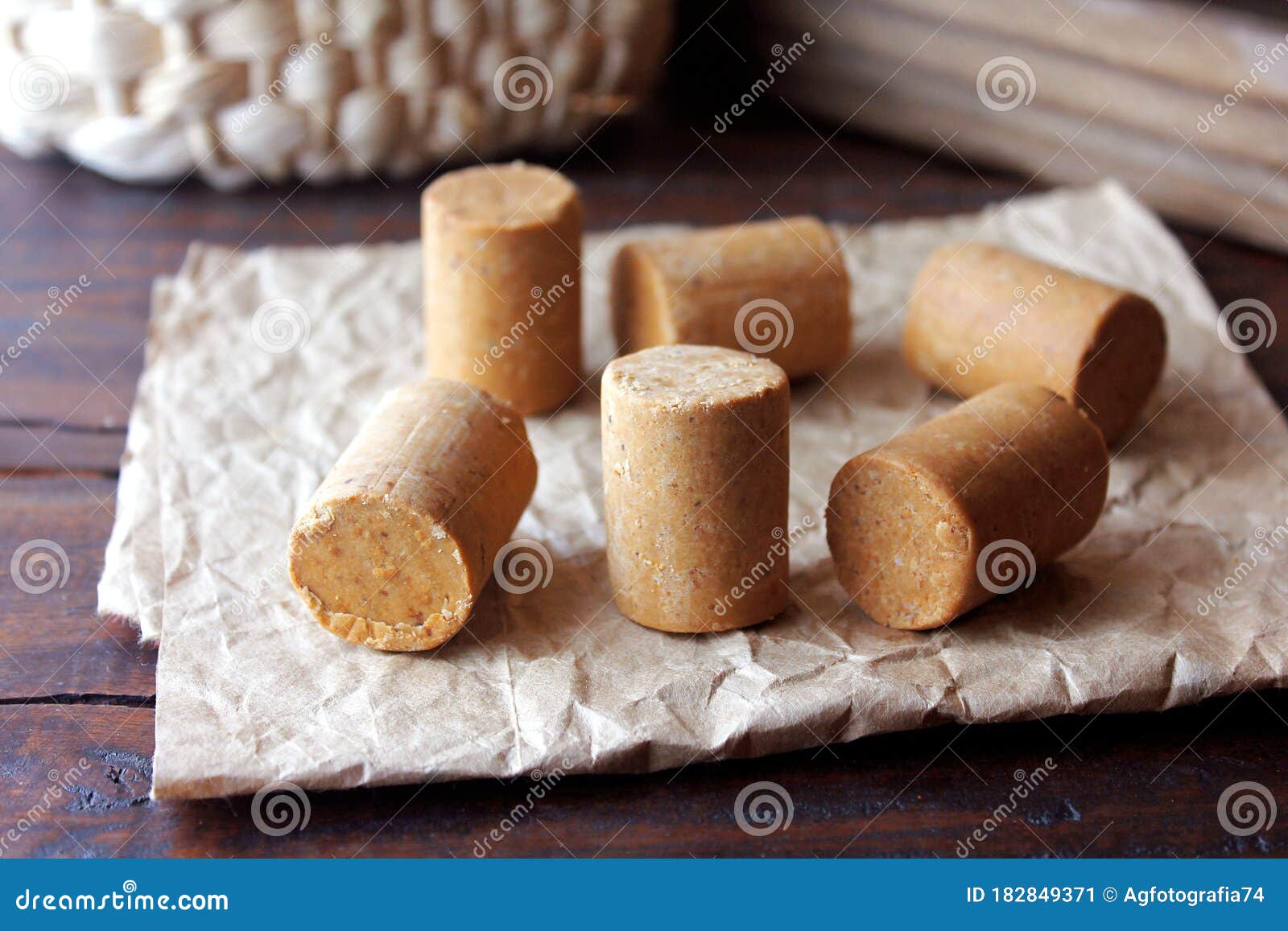 peanut candy paÃÂ§oca or pacoca traditional brazilian sweet based on peanuts, manioc flour and sugar on a rustic wooden table